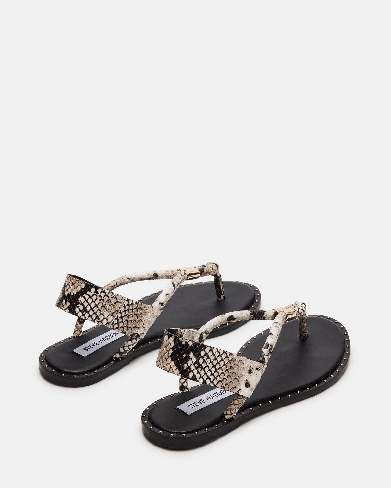 Side view of edgy Meduza Snake thong sandals highlighting the studded design