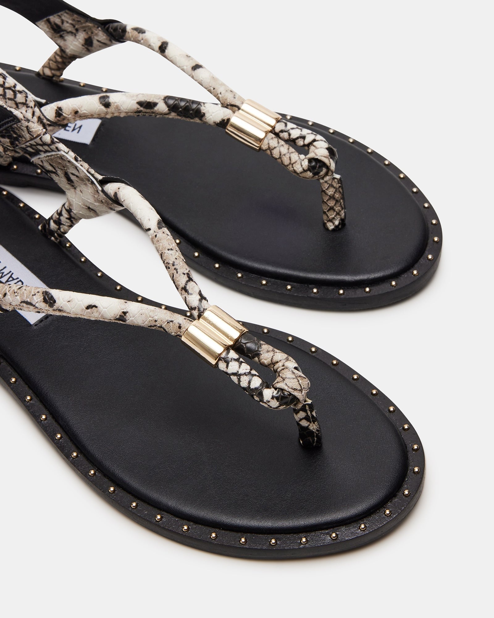 Fashionable black thong sandals with heels worn with summer outfit for 2025