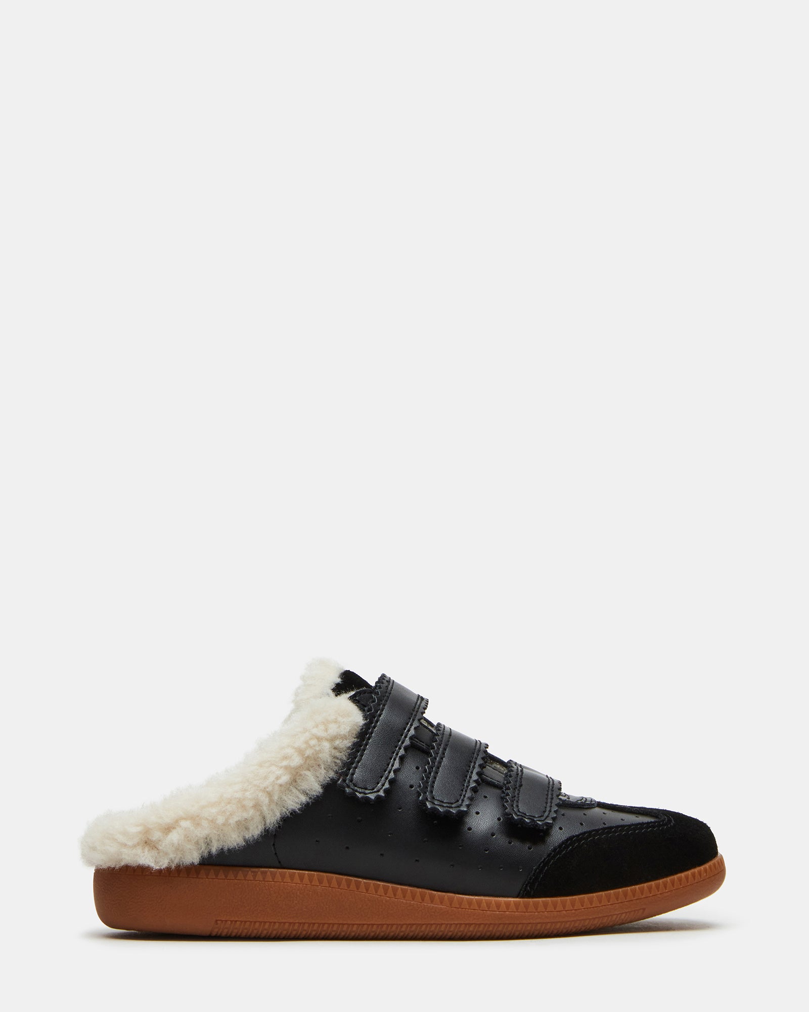 Close-up of Memento shearling lined tennis shoes with Velcro straps.