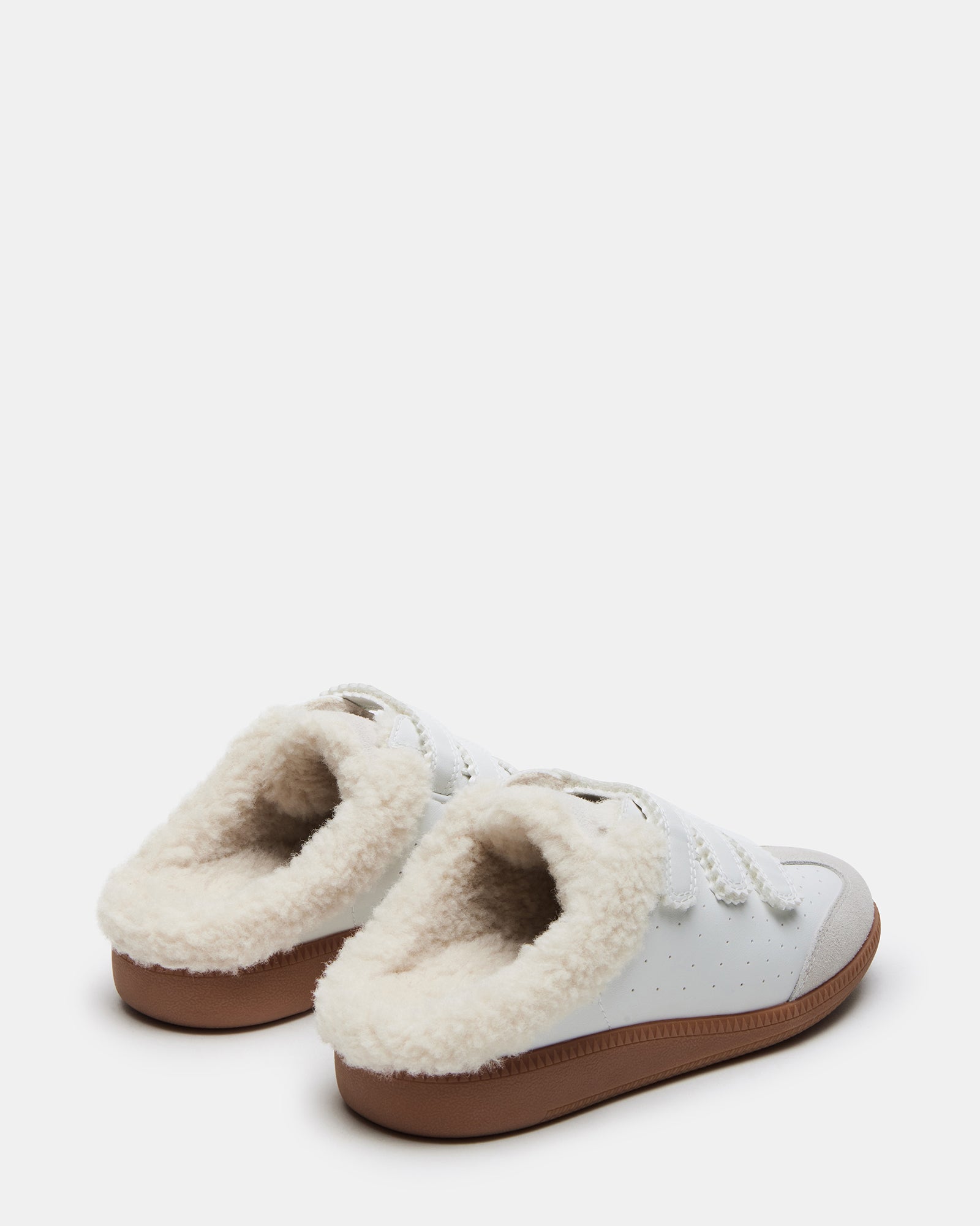 Close-up of velcro straps on womens slip-on sneakers showing easy fastening and stylish design