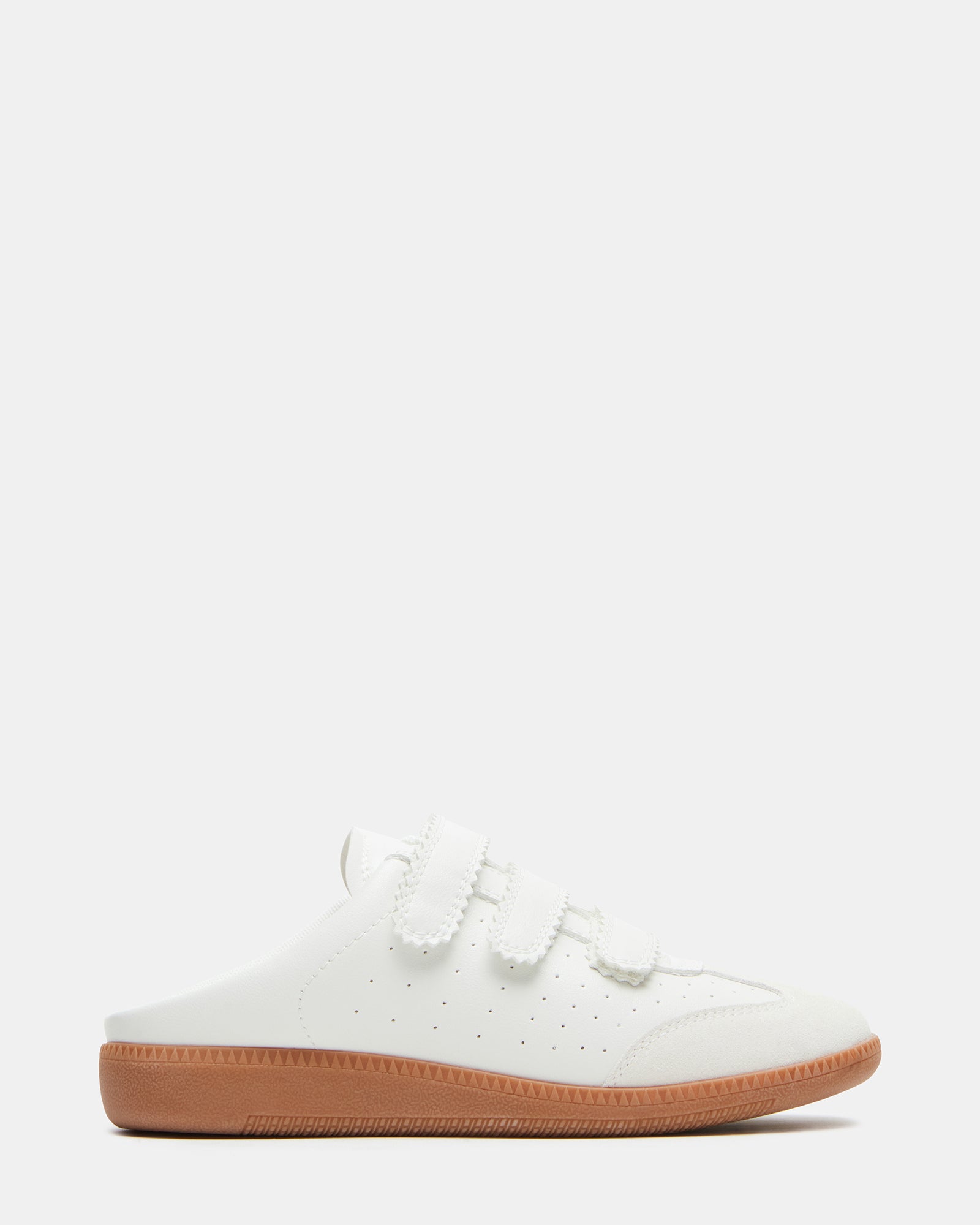 White mule shoes from a side angle, showcasing Velcro straps