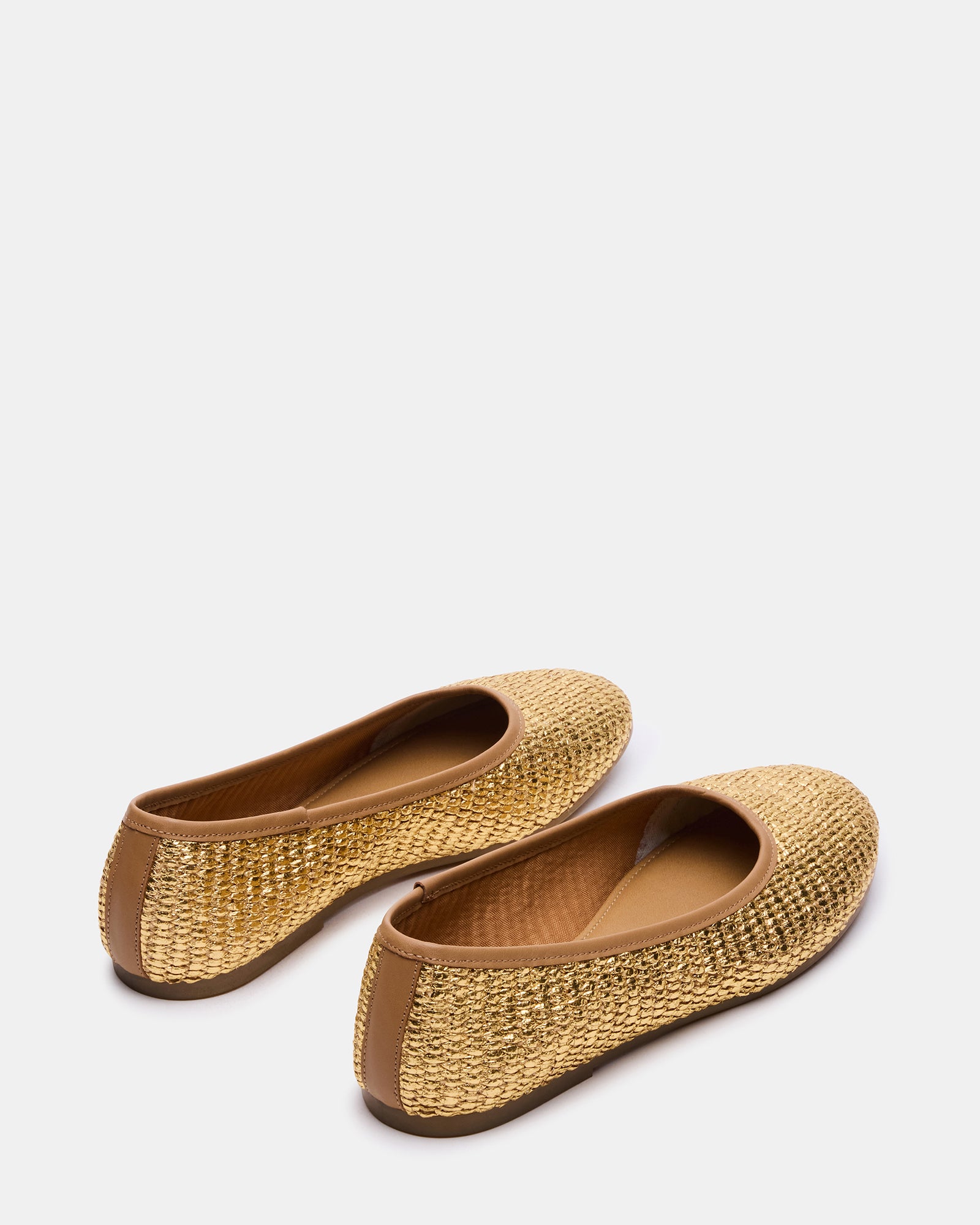 Merlot gold flats styled with linen trousers for summer outfits