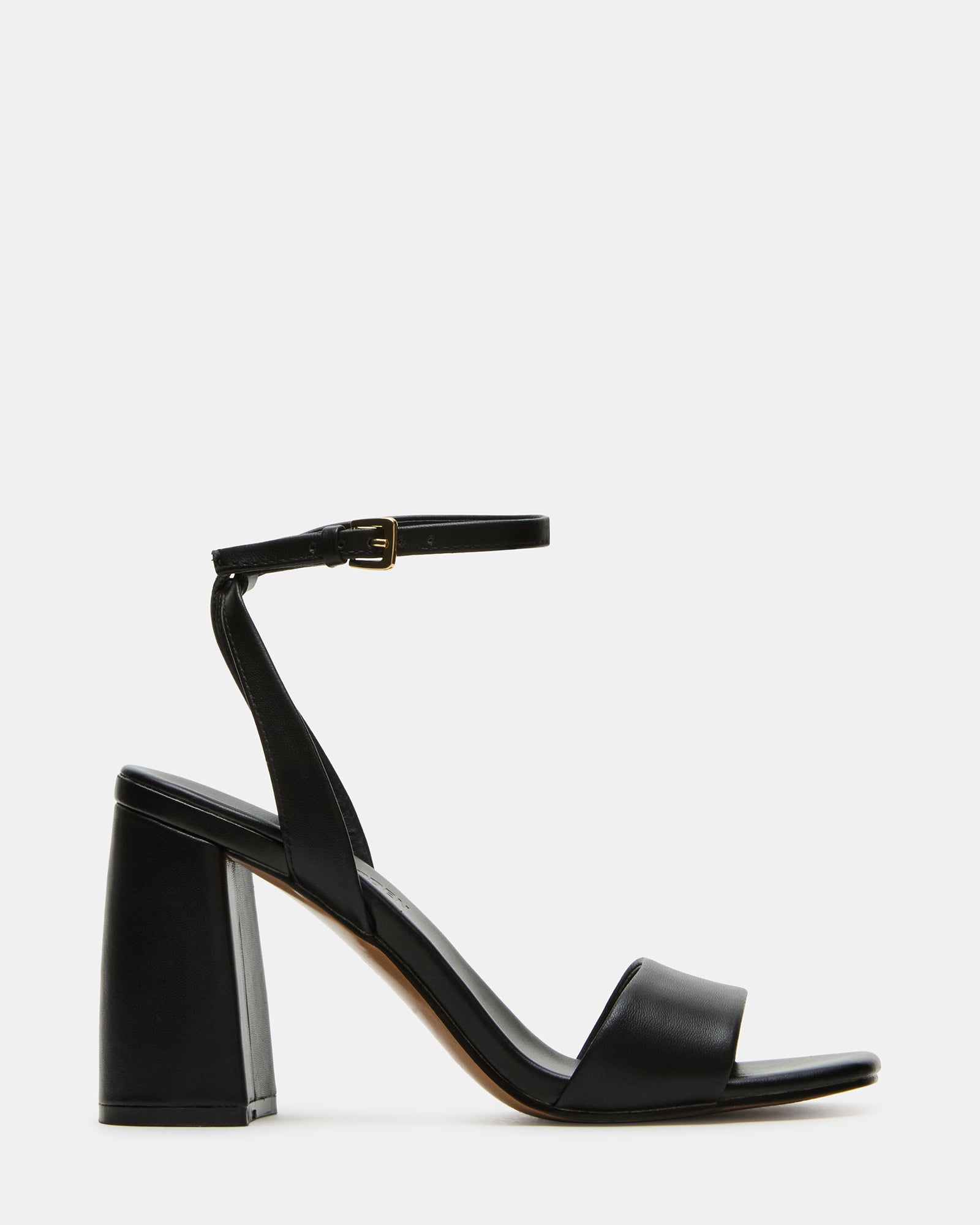 MESSA black platform heels worn with tailored pants for a polished look