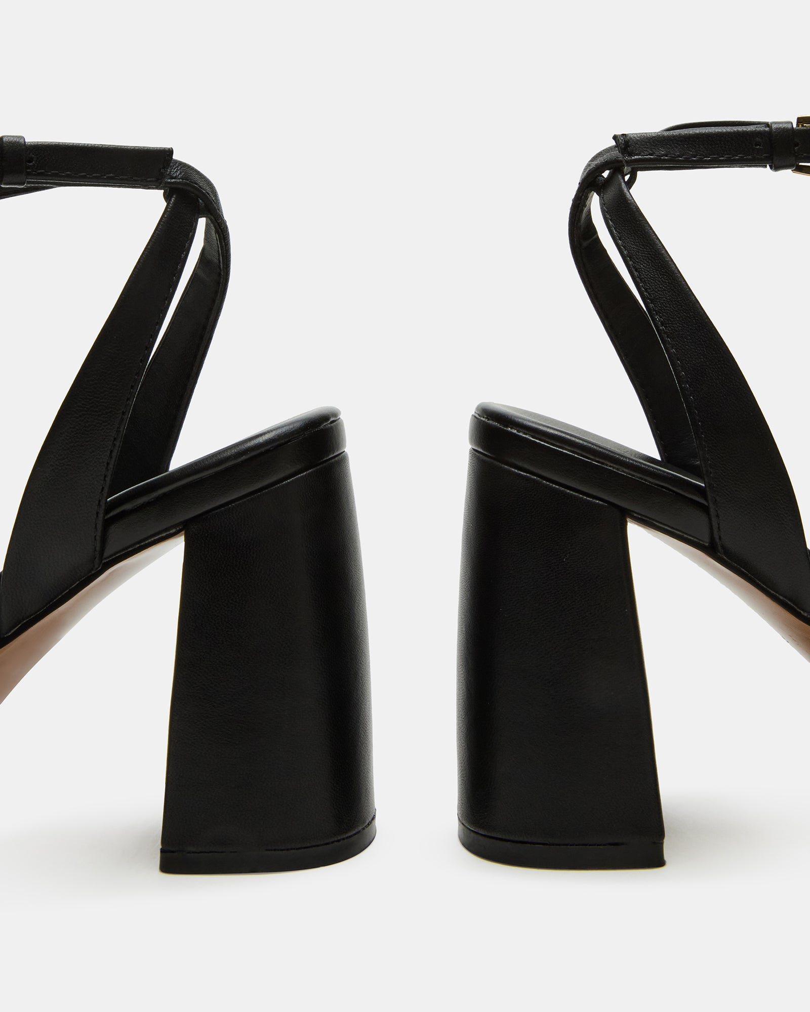 MESSA black platform heels worn with tailored pants for a polished look