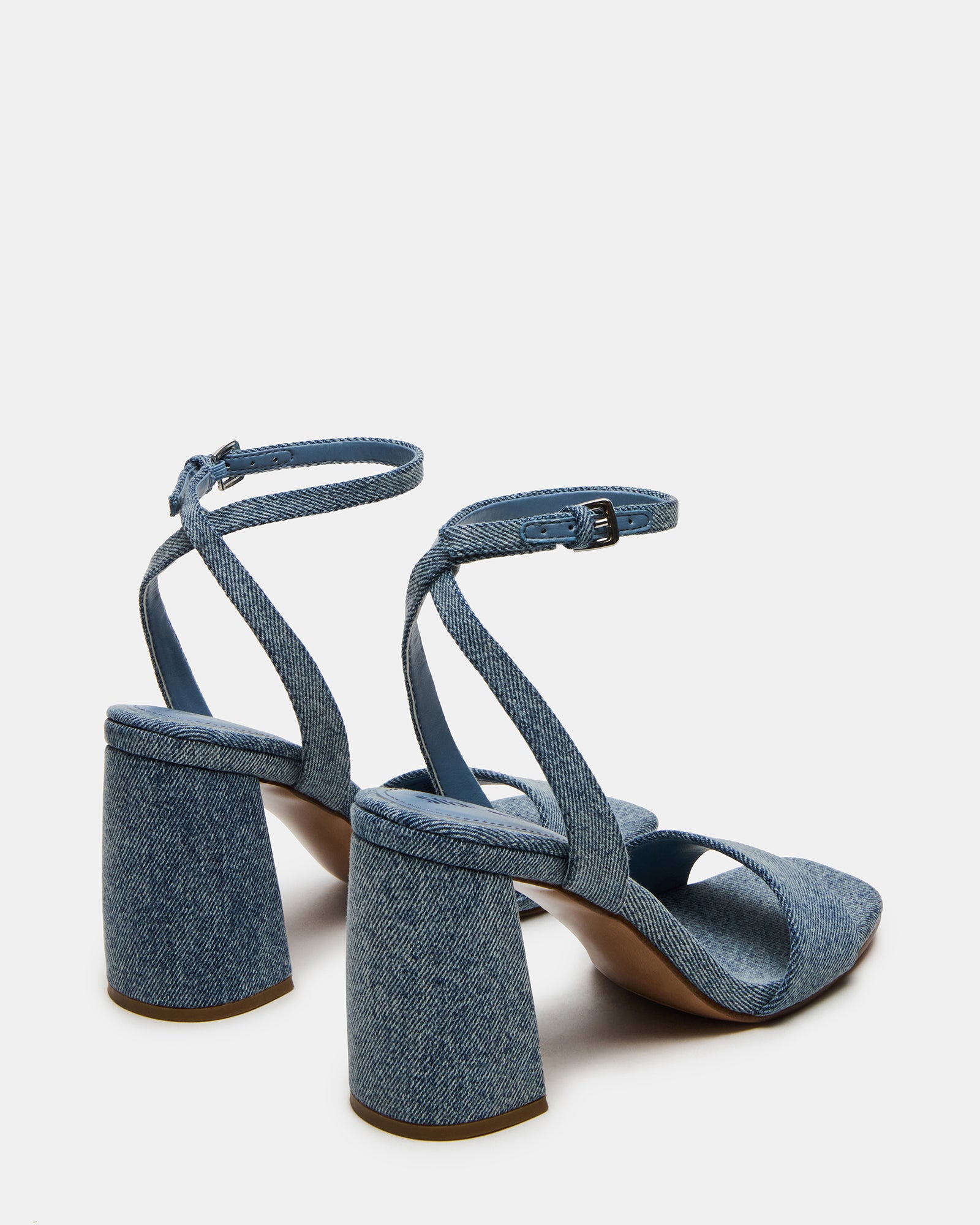 White block heels in a summer outfit with denim and a blouse