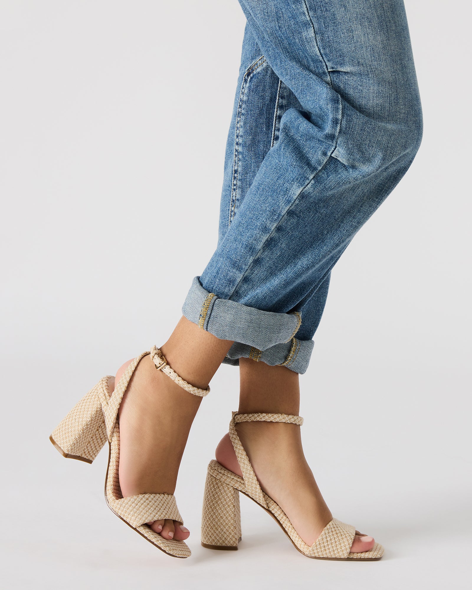 Close-up of the square toe detail on stylish black block high heel shoes.