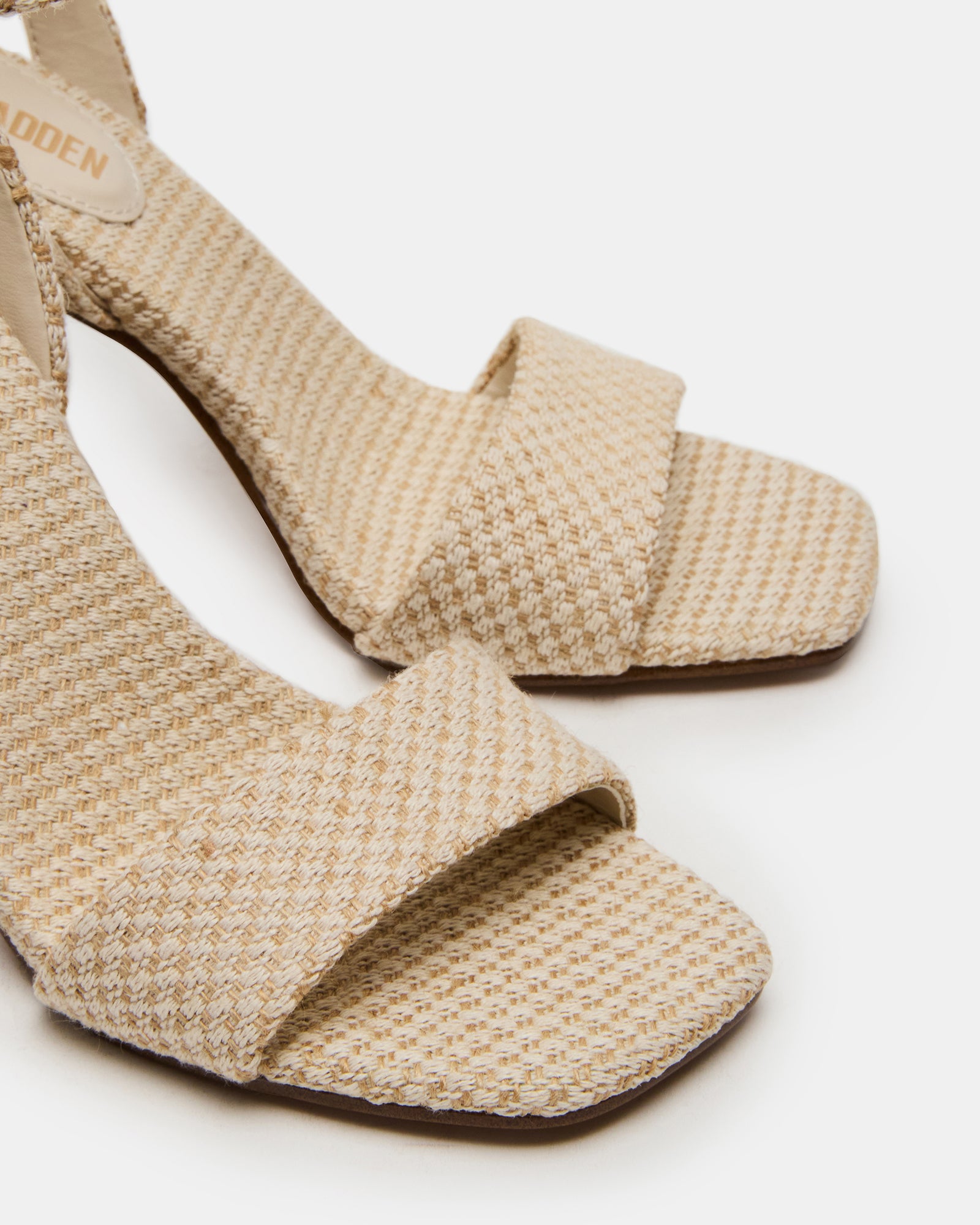 Side view of nude block heel shoes with ankle strap for a chic look.