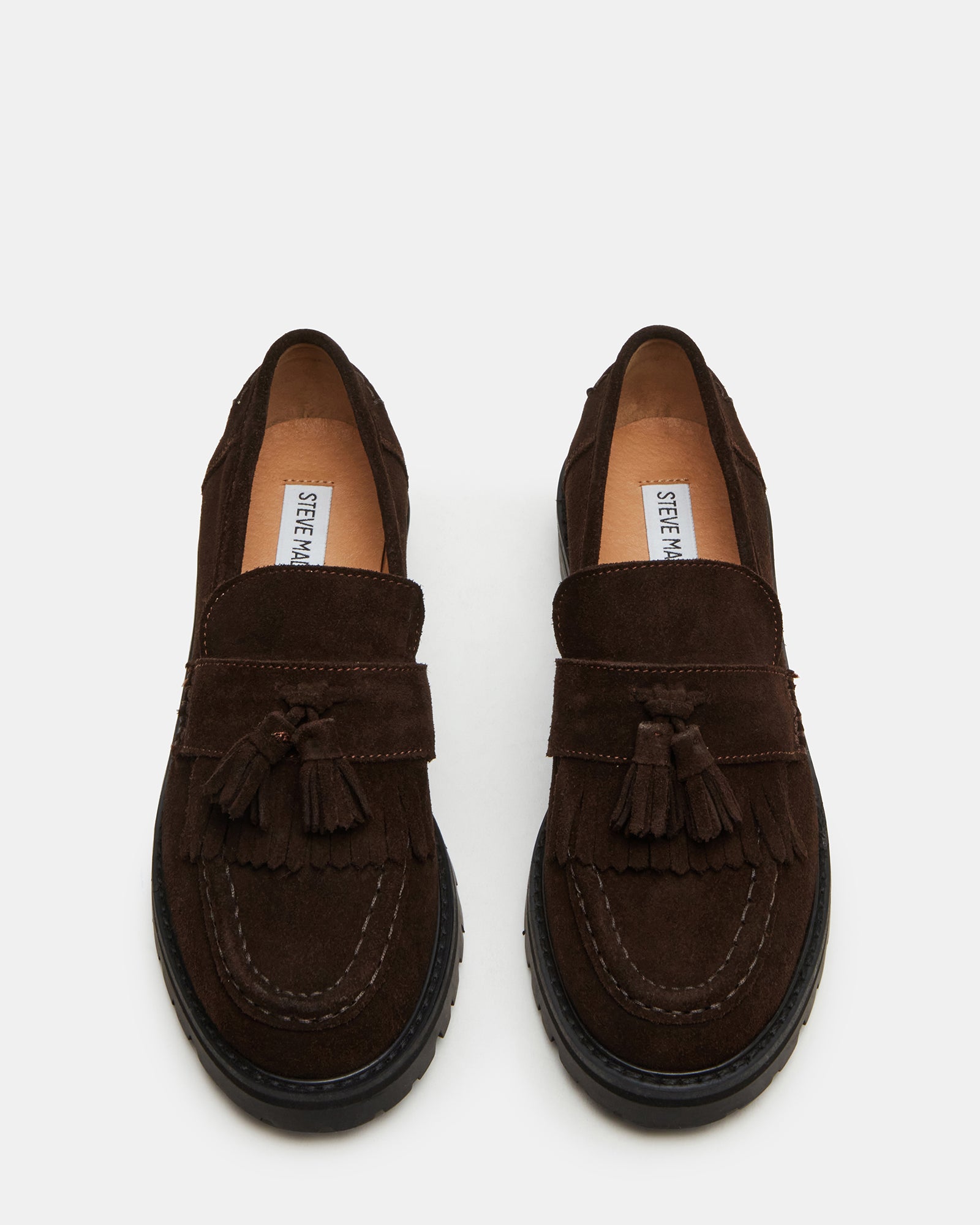 Side profile of mens loafers showing tassel detail and treaded sole.