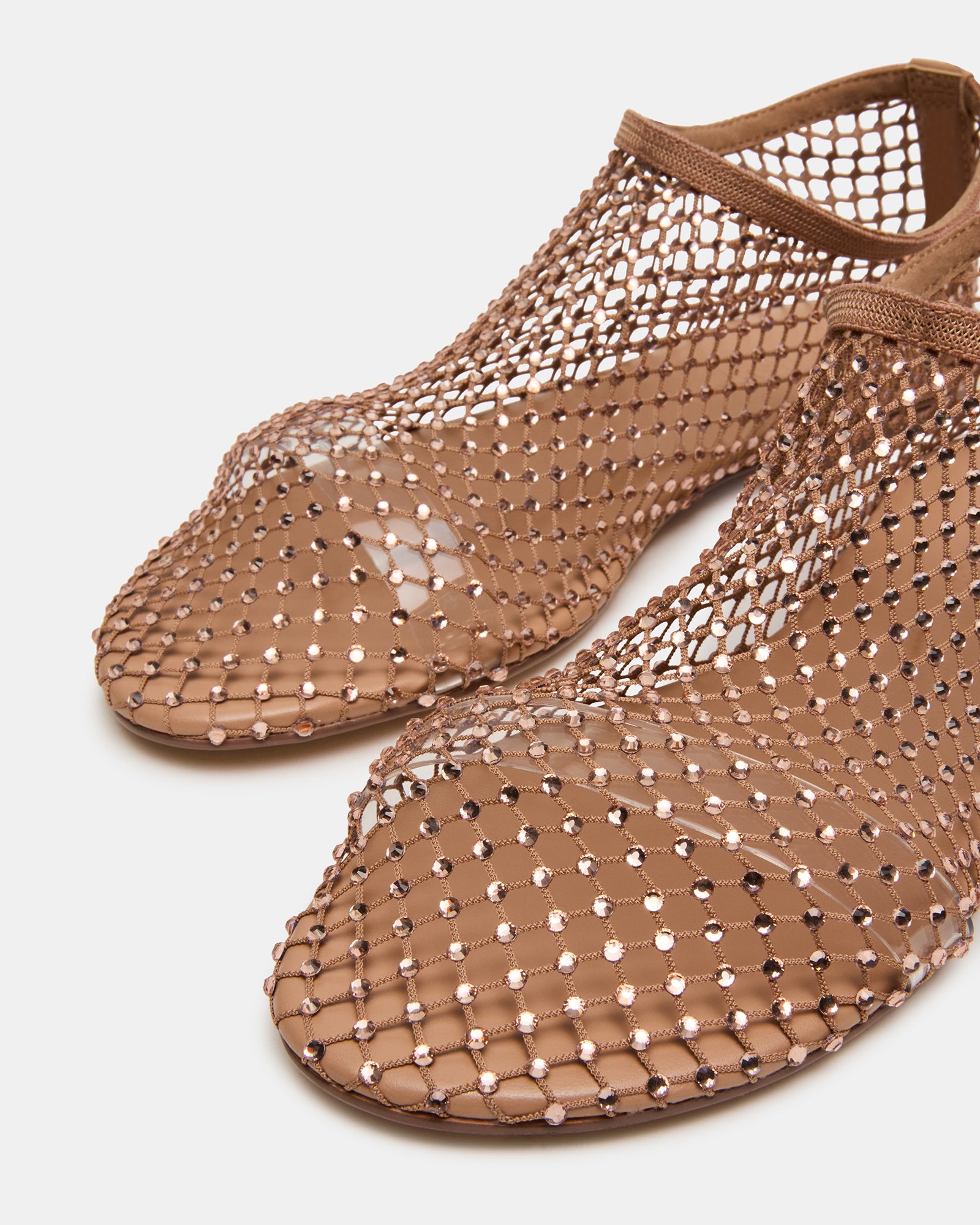 Lifestyle image of ballet flats with rhinestones paired with a spring outfit for outdoor occasions