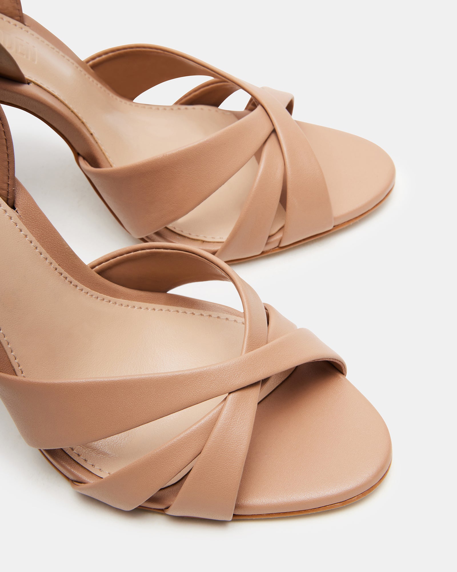 Silver slingback heels adding a touch of glamour to an outfit.