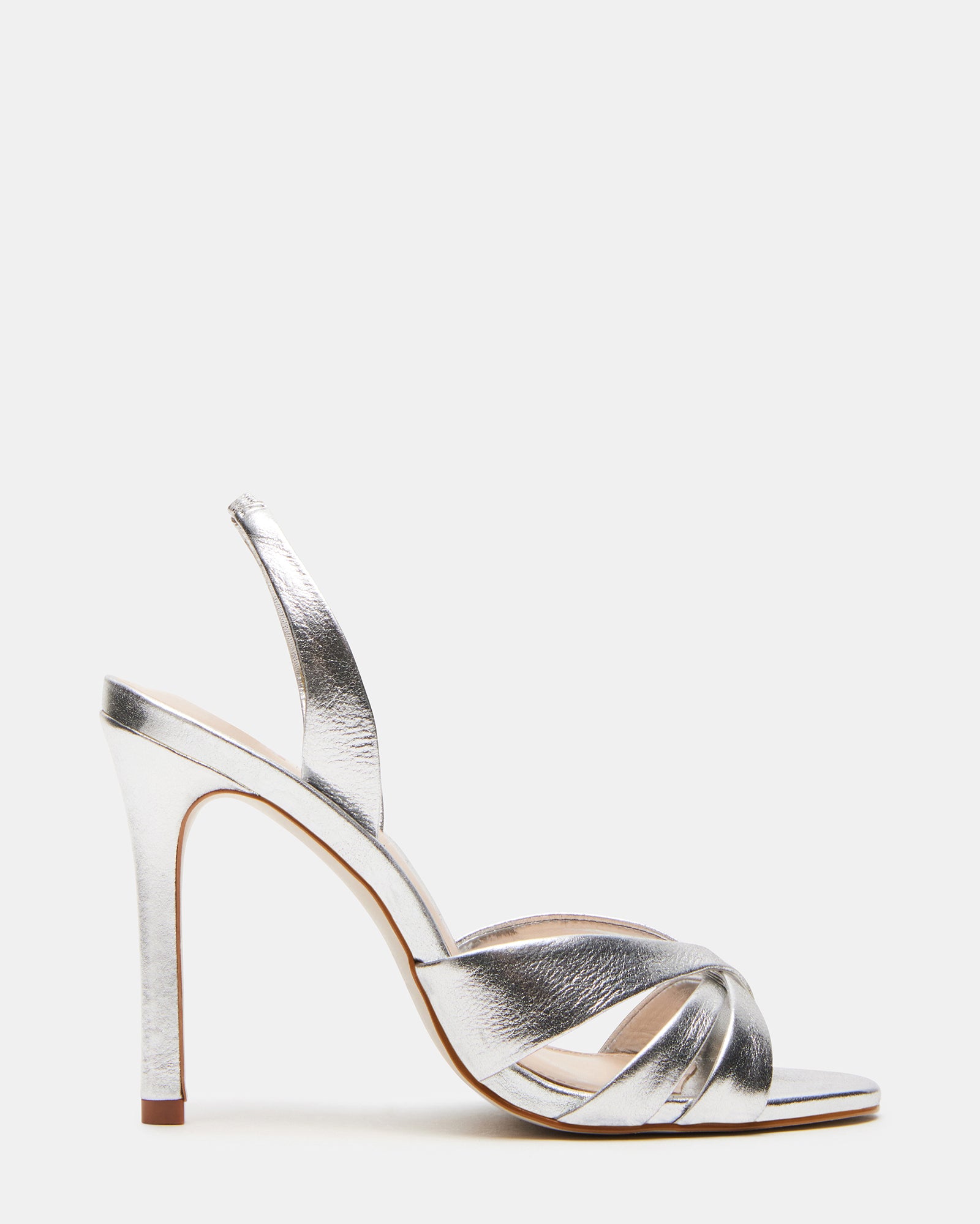 Close-up of MINX silver heels showing stiletto heel and slingback strap