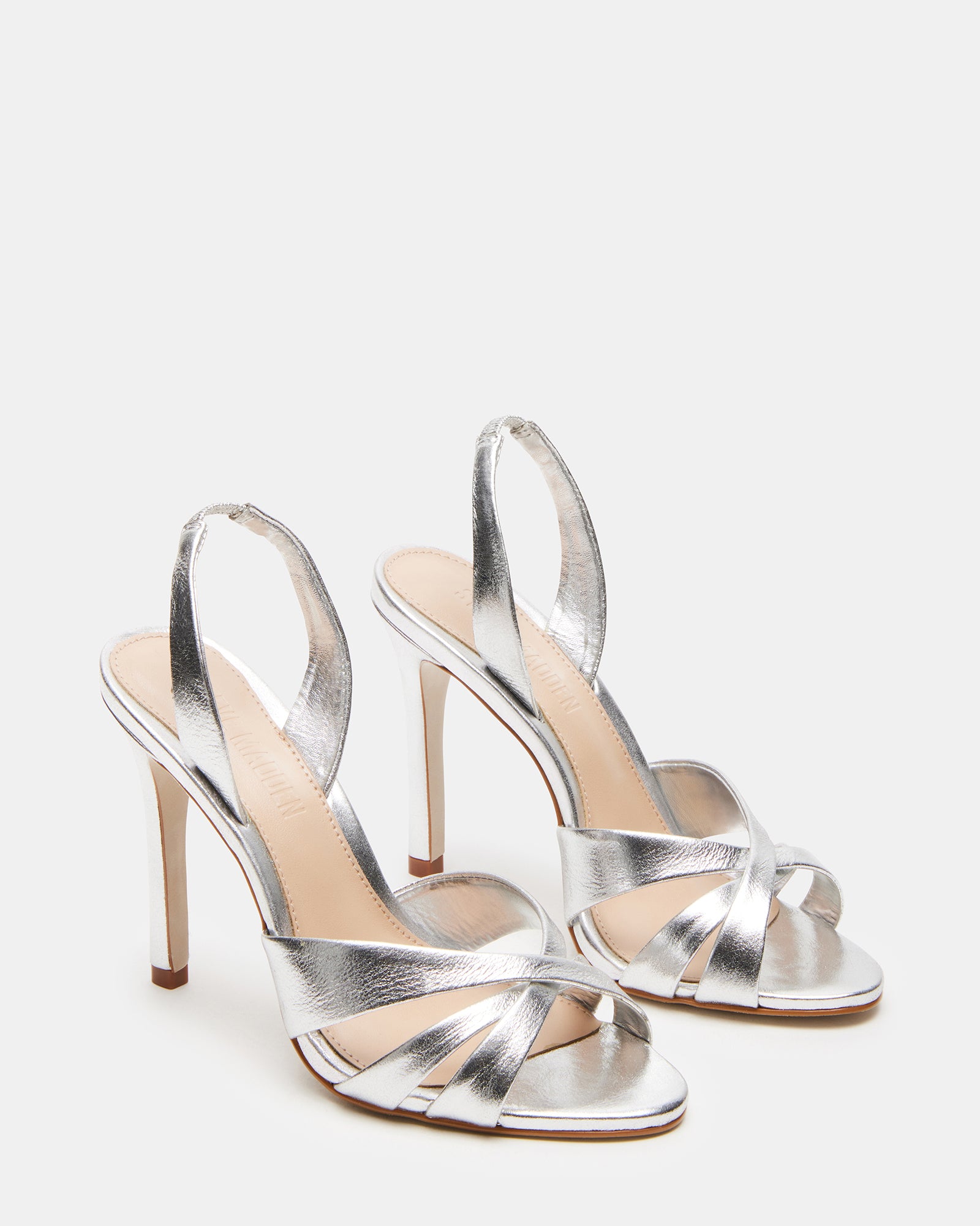 Model wearing MINX silver platform heels with cocktail dress
