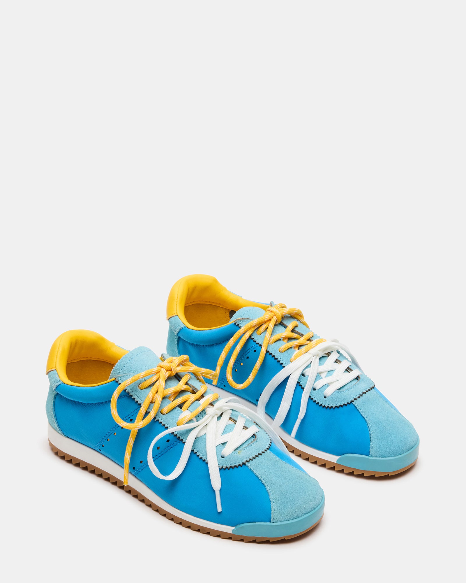 Close-up of Mirage low-top sneakers showing suede and textile details