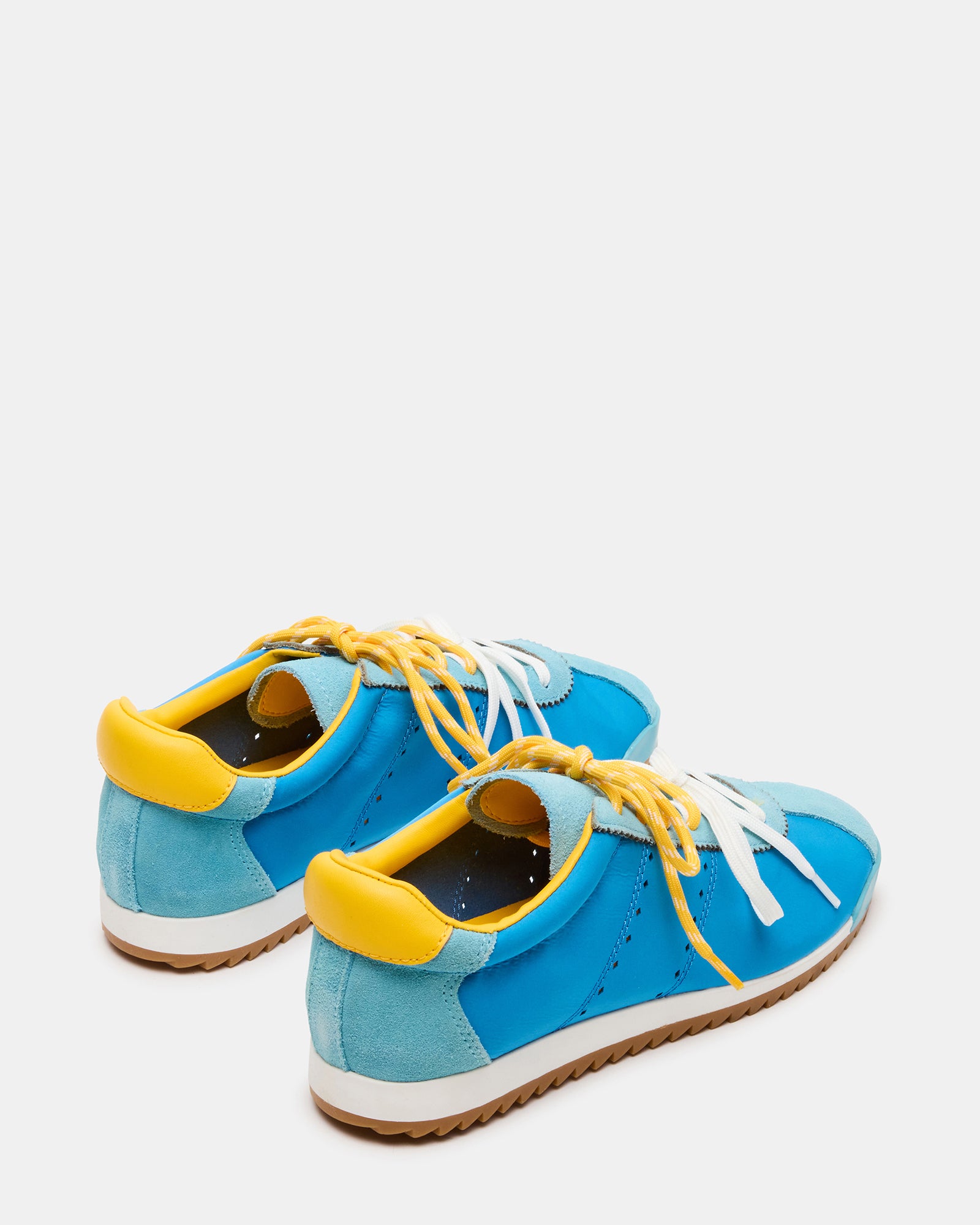 Close-up of Mirage low-top sneakers showing suede and textile details