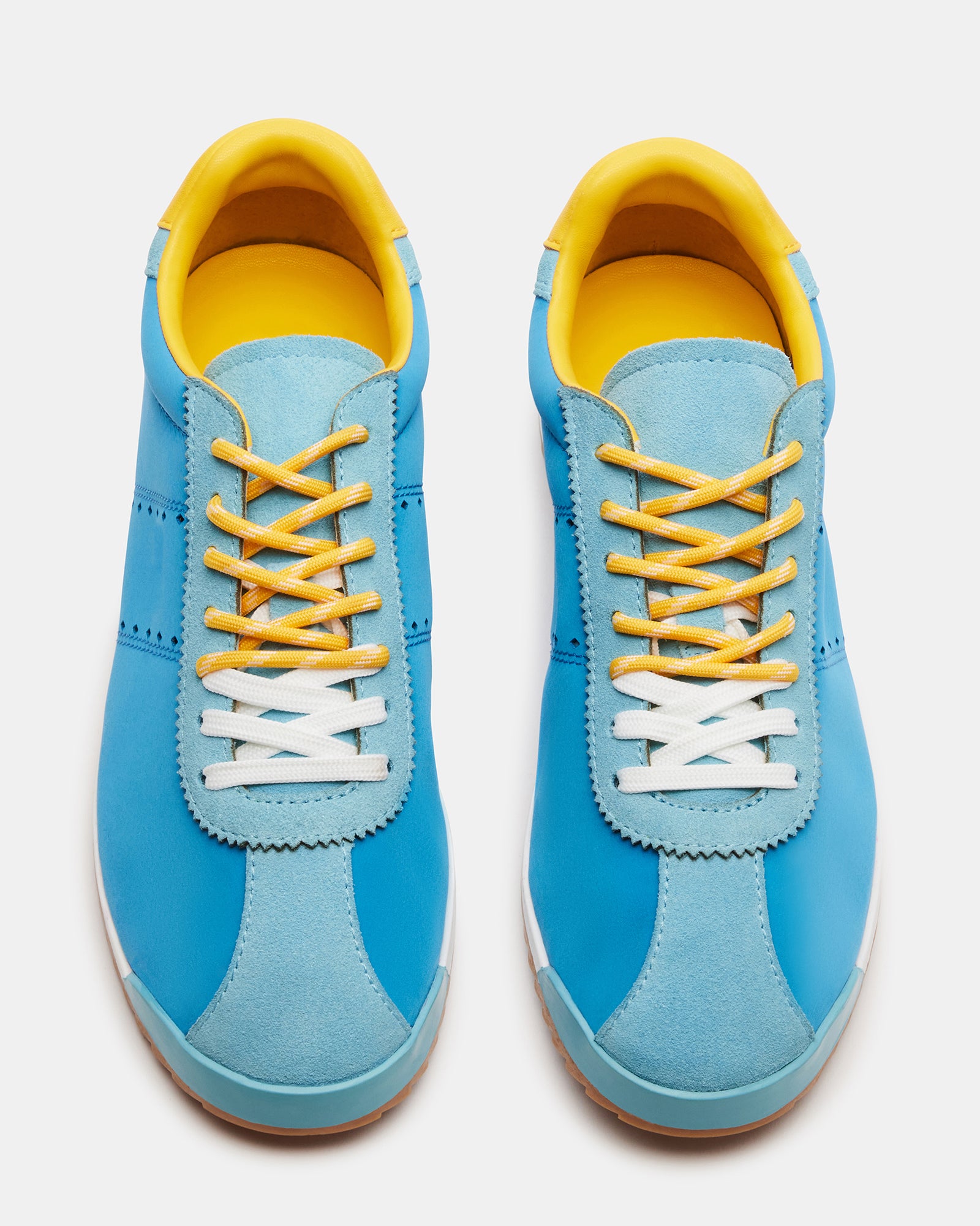 Close-up of Mirage low-top sneakers showing suede and textile details