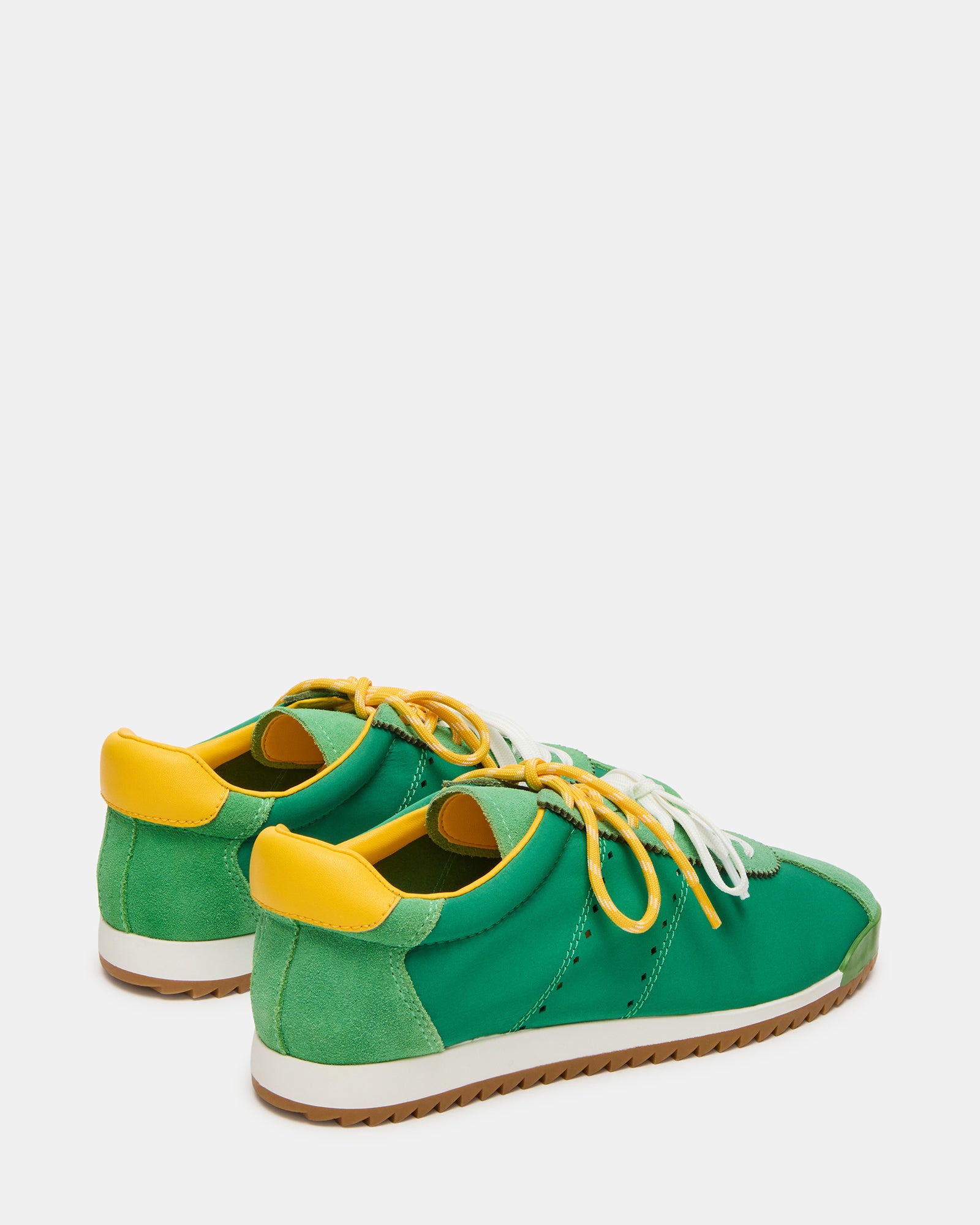 Side view of Mirage sneakers with striped laces and green accents