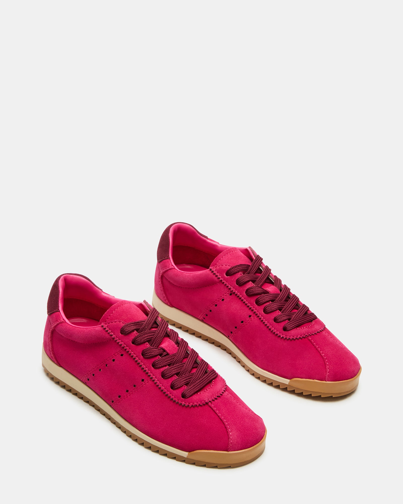 Mirage lace-up sneakers styled with casual outfit in urban setting.