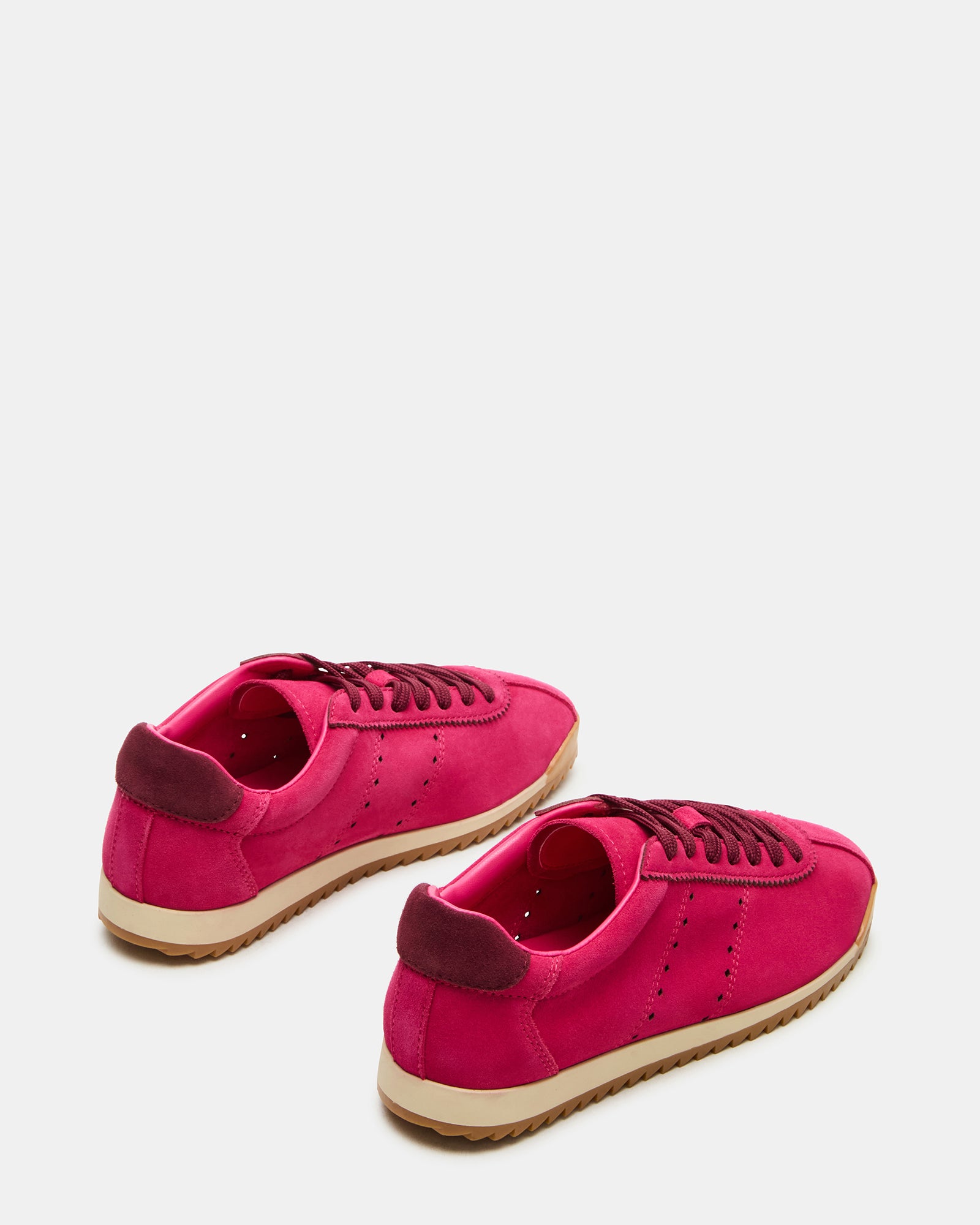 Mirage lace-up sneakers styled with casual outfit in urban setting.