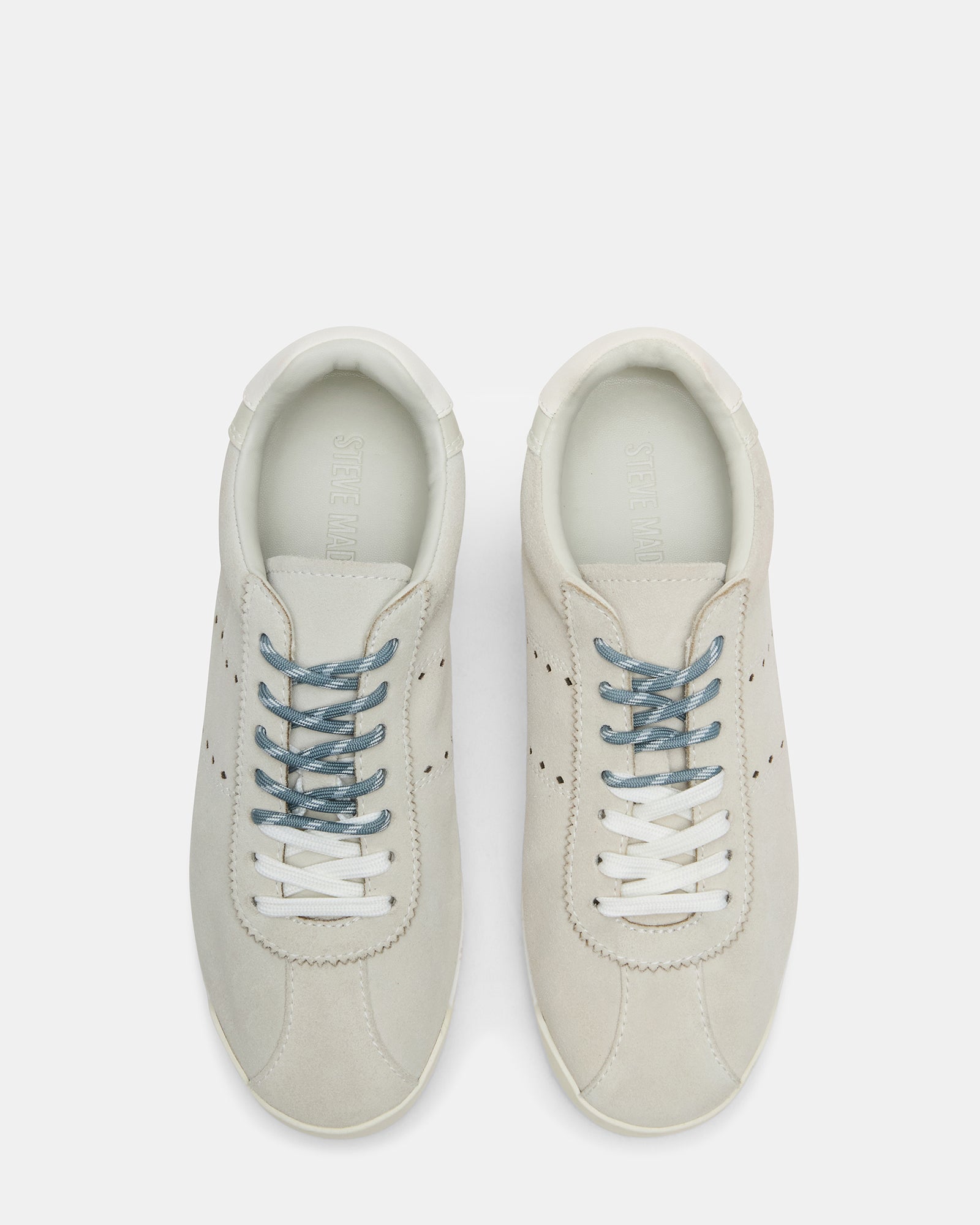 Side view of low-top Mirage sneakers styled with jeans for daily wear
