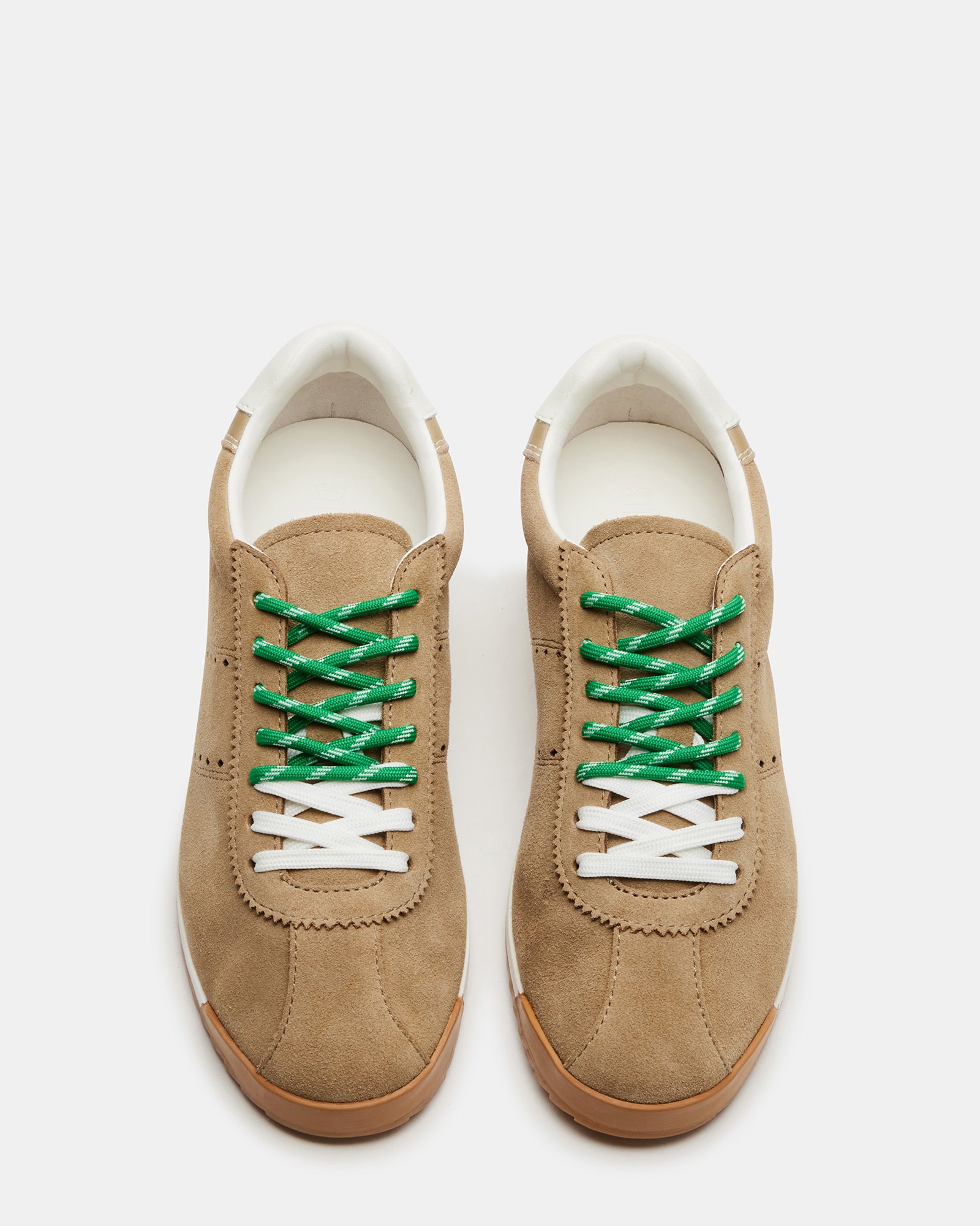 Close-up of Mirage lace-up sneakers highlighting suede texture and laces.