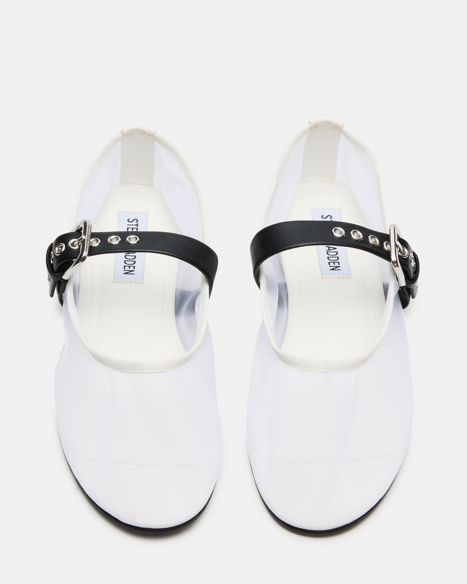 Side view of Mitsy flats shoes showing breathable mesh upper and low heel.