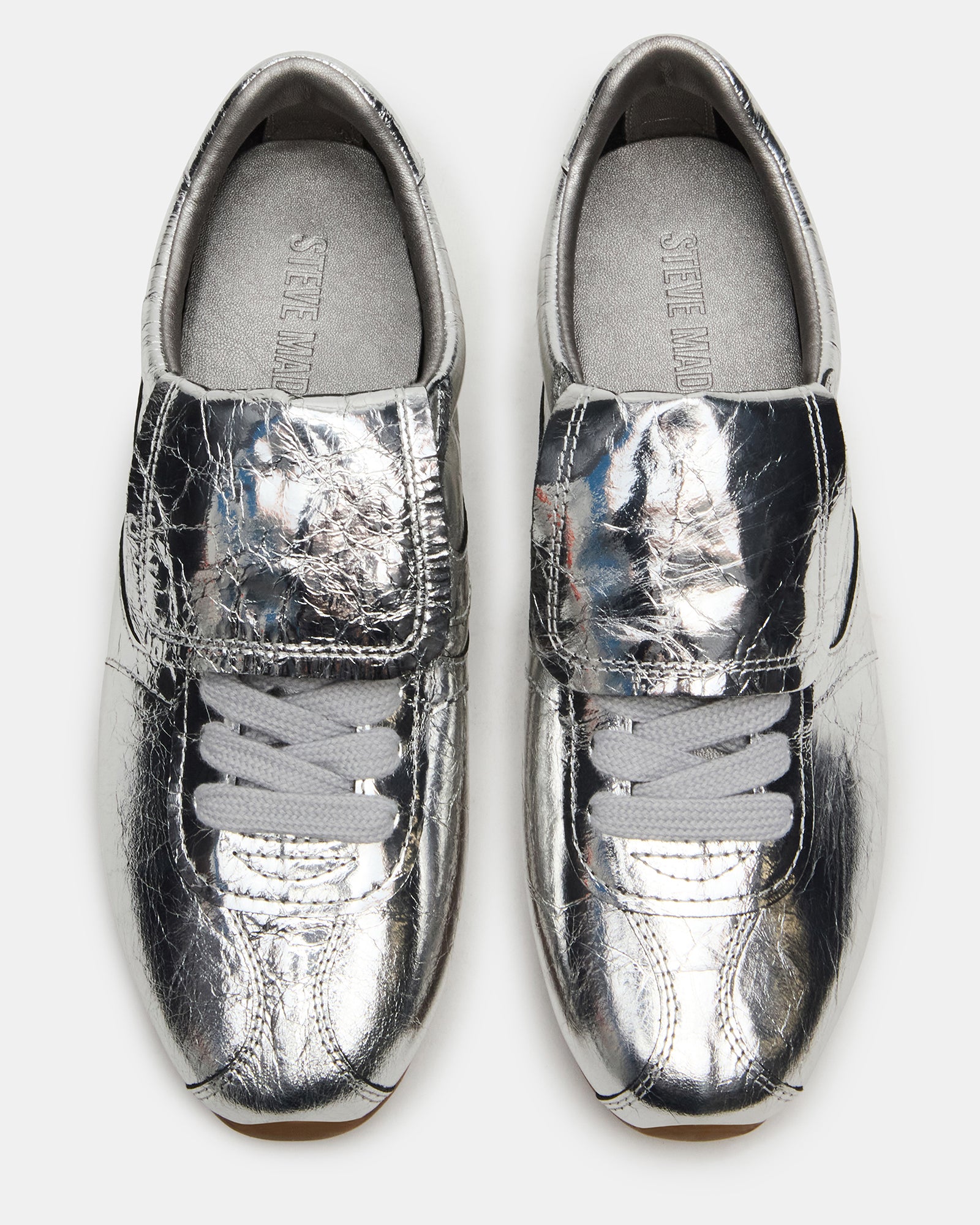Side view of Mobility Silver Leather sneakers highlighting the low-top design and premium leather material