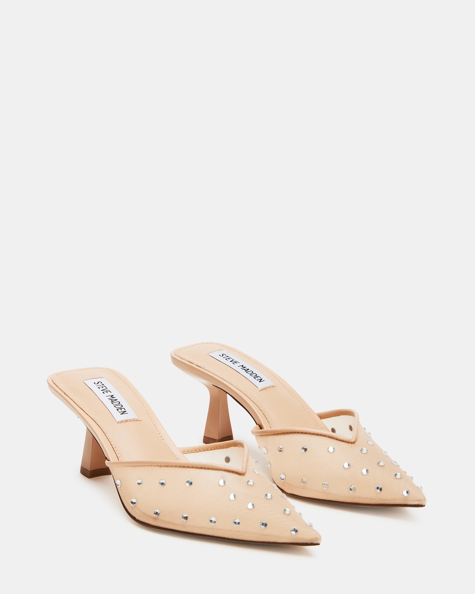 Side view of kitten heel boots-style silhouette with blush tone and sparkle