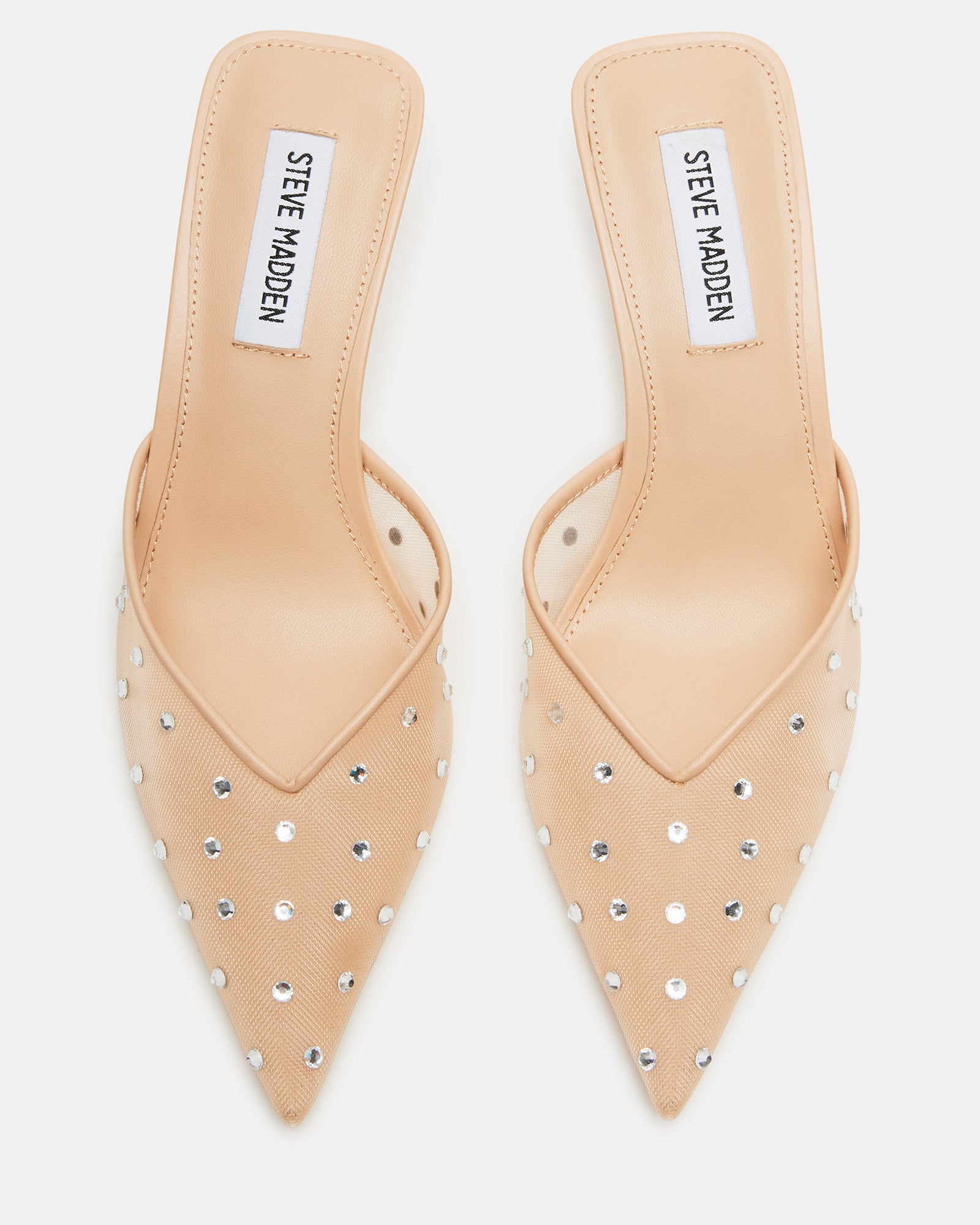 Close-up of blush mule heels showing pointed toe and rhinestone mesh detailing