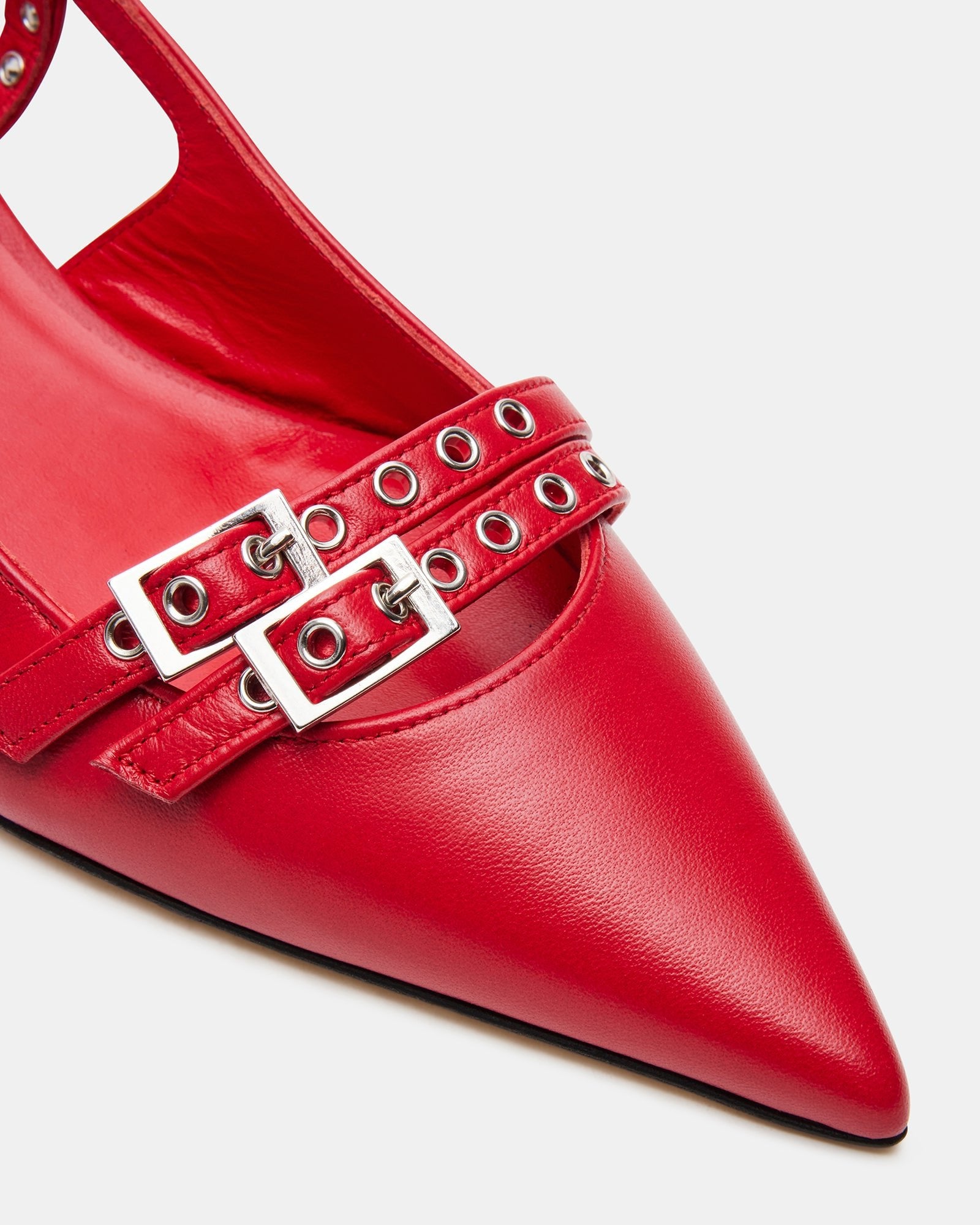 Woman wearing MODISH red leather shoes paired with a chic outfit