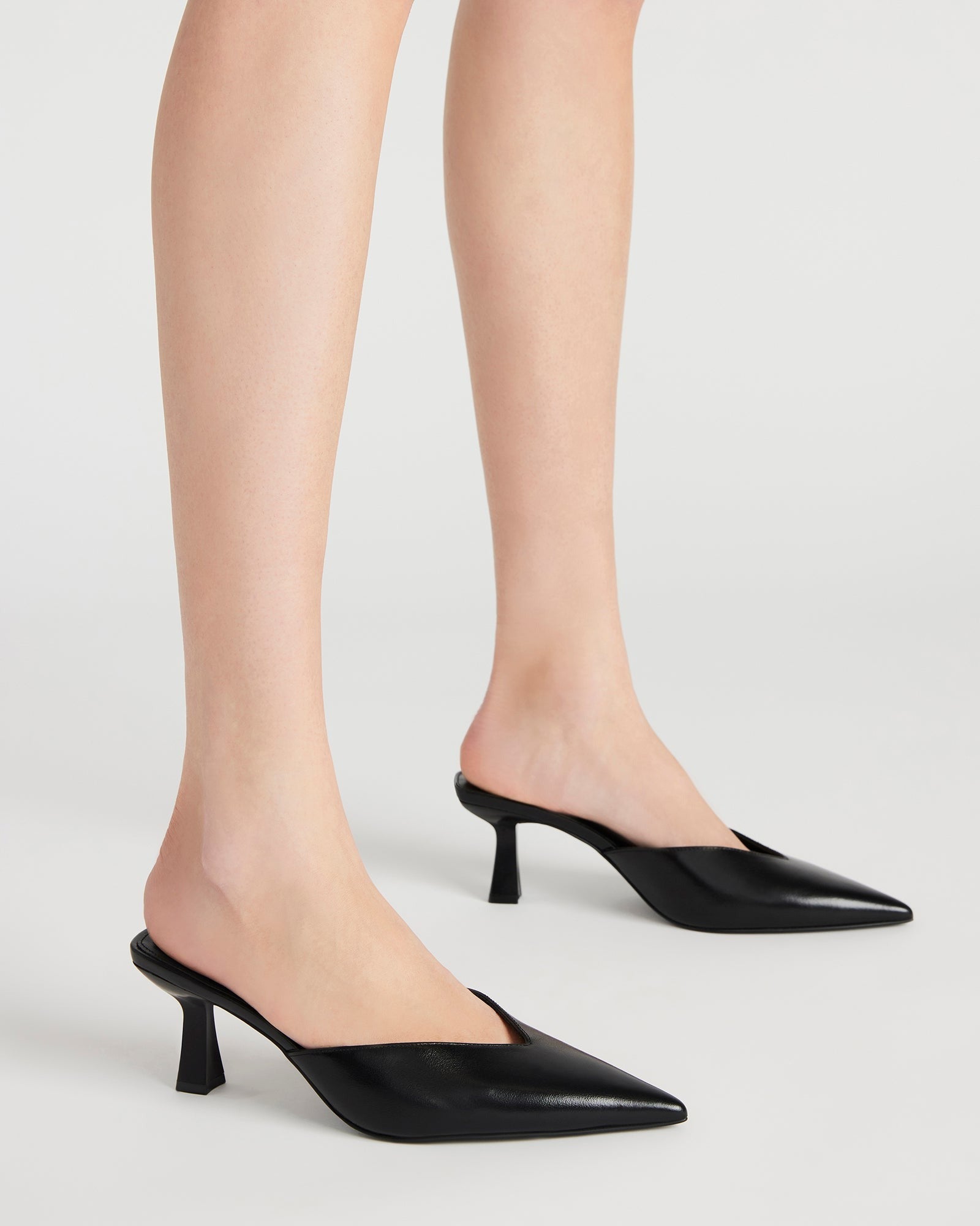 Side view of kitten heel design on MOD silver heels, perfect for evening wear