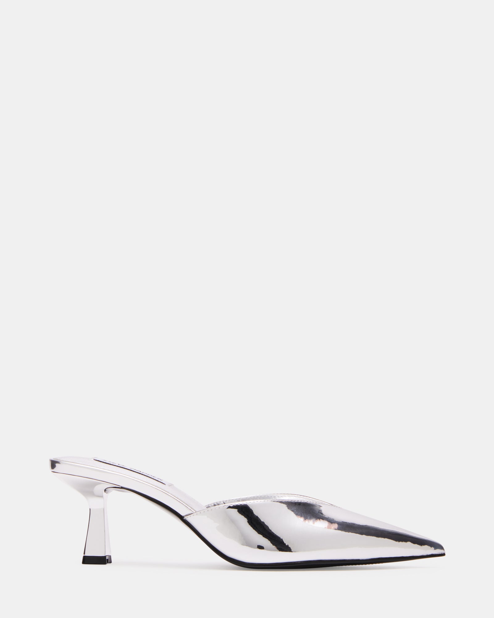 MOD silver foil mule heels styled with black tailored pants for a polished look