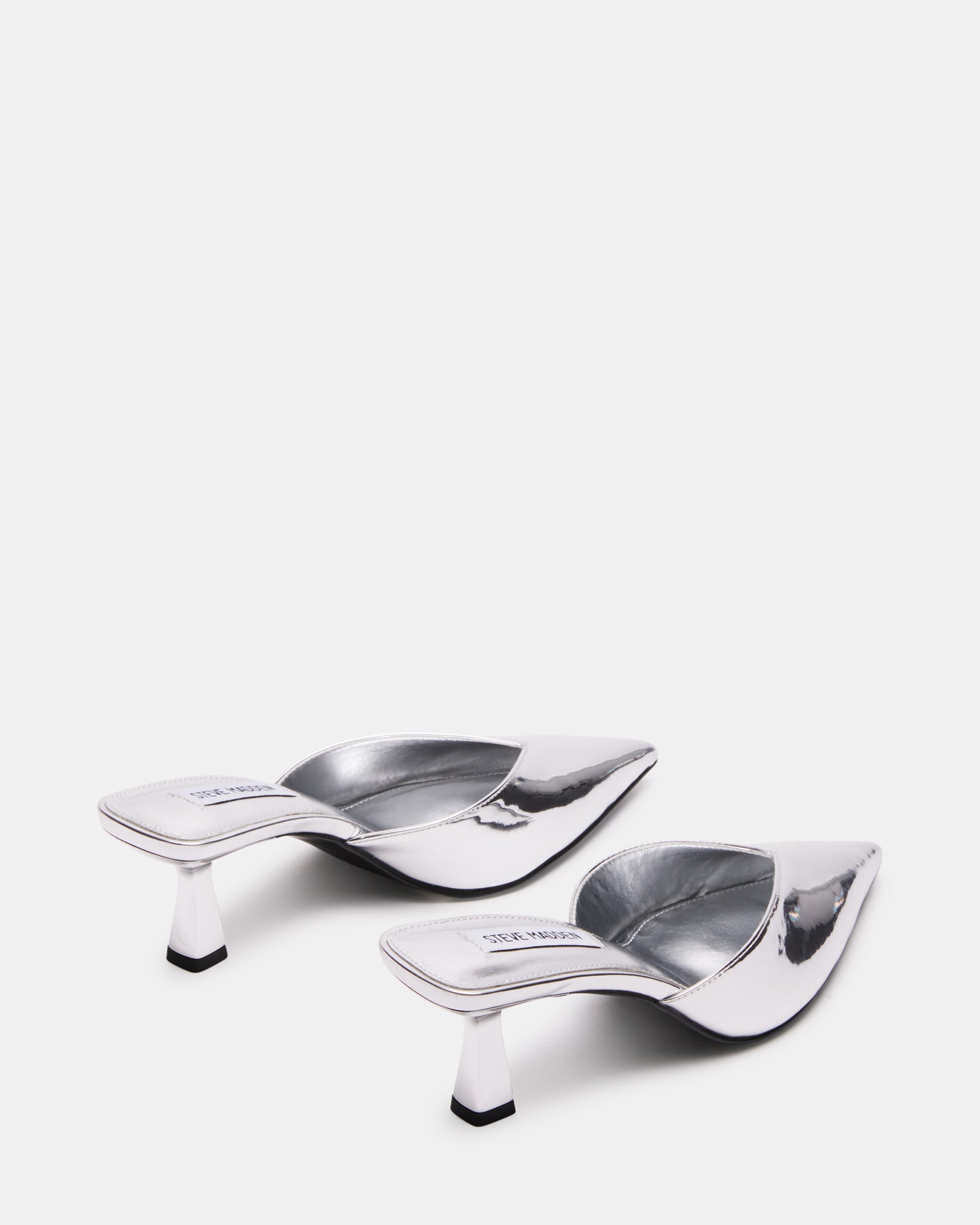 Close-up of the pointed toe and metallic finish on MOD mule heels