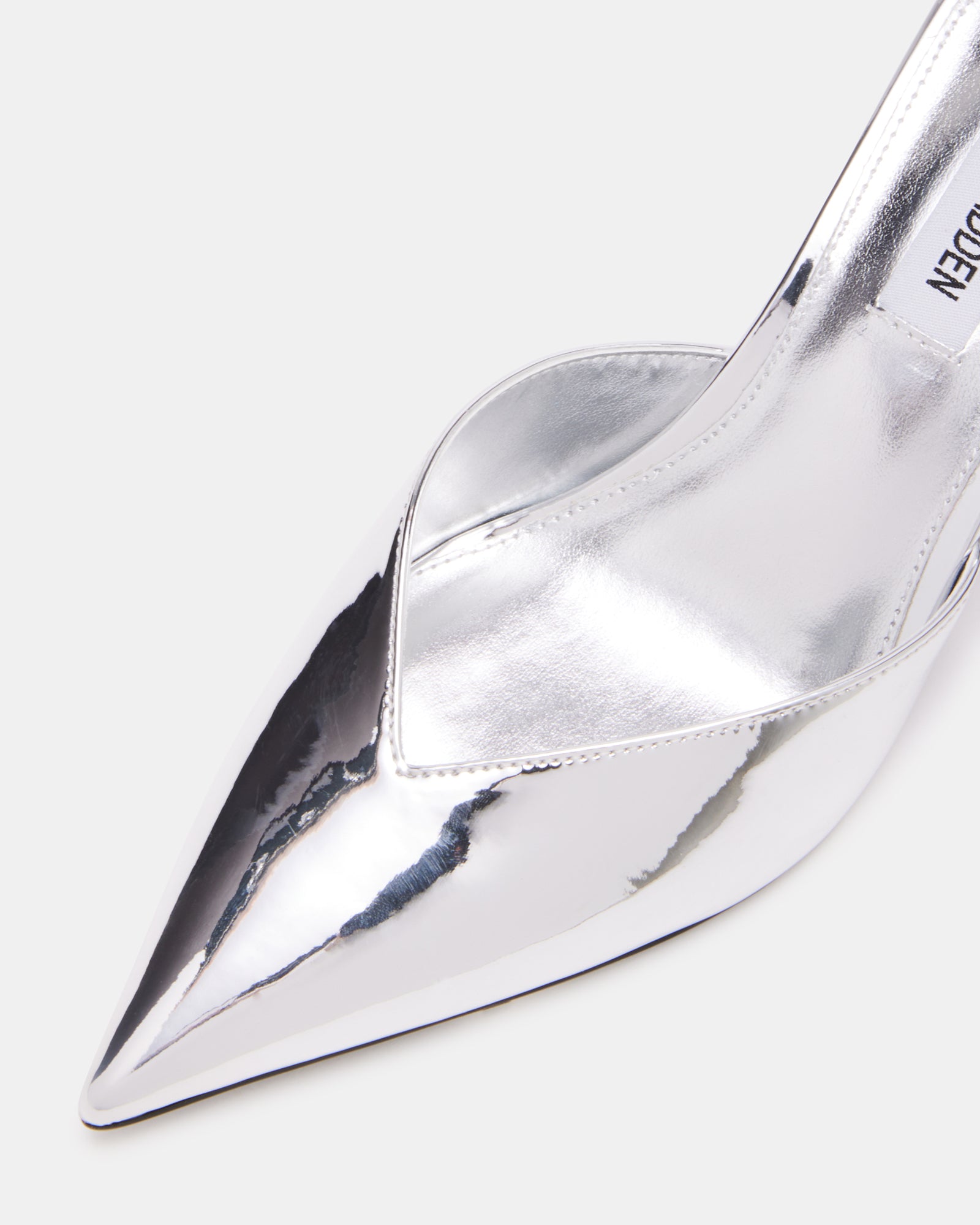 Side view of kitten heel design on MOD silver heels, perfect for evening wear