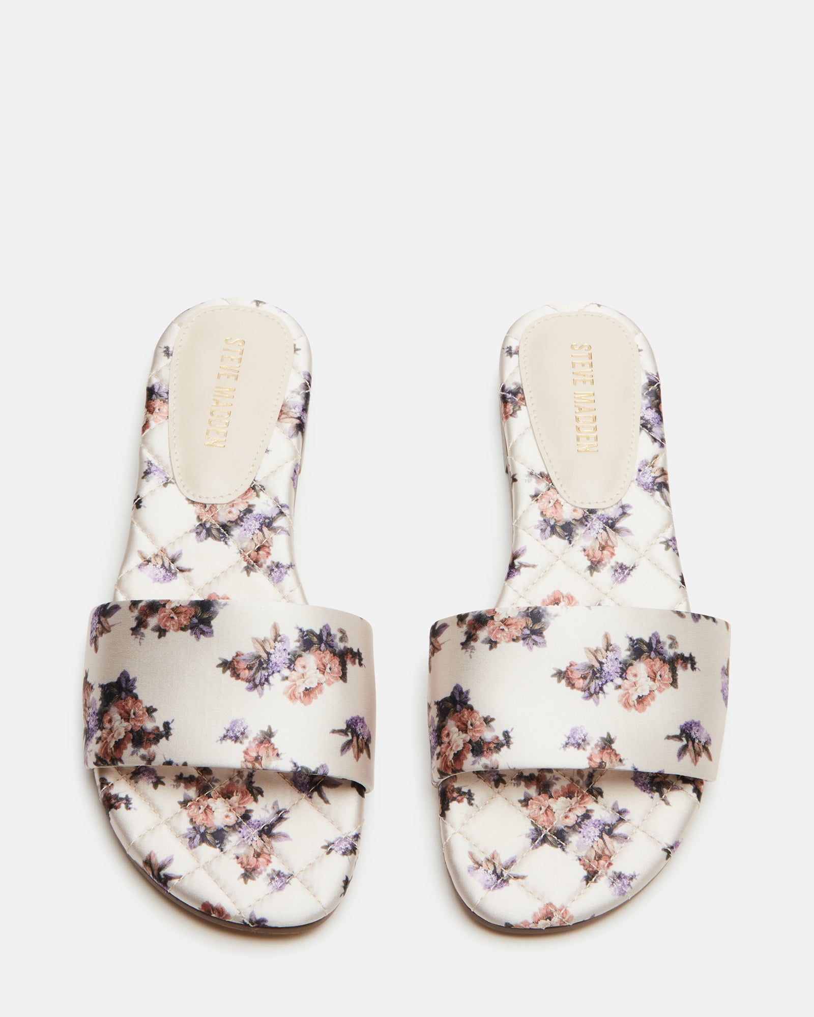 Stylish quilted slide sandals for women, showcasing the elegant design.