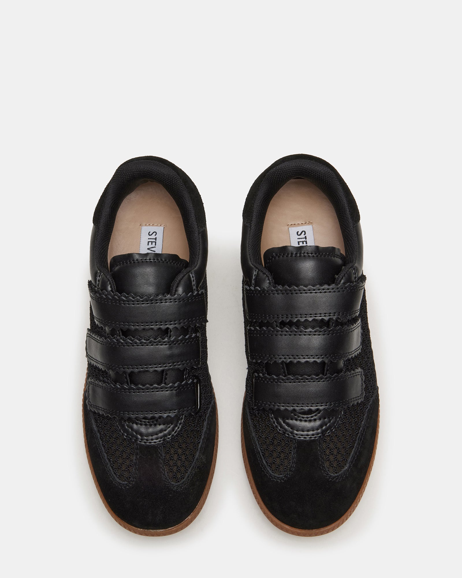 Side view of black mesh Velcro sneakers for women, showcasing design and comfort.