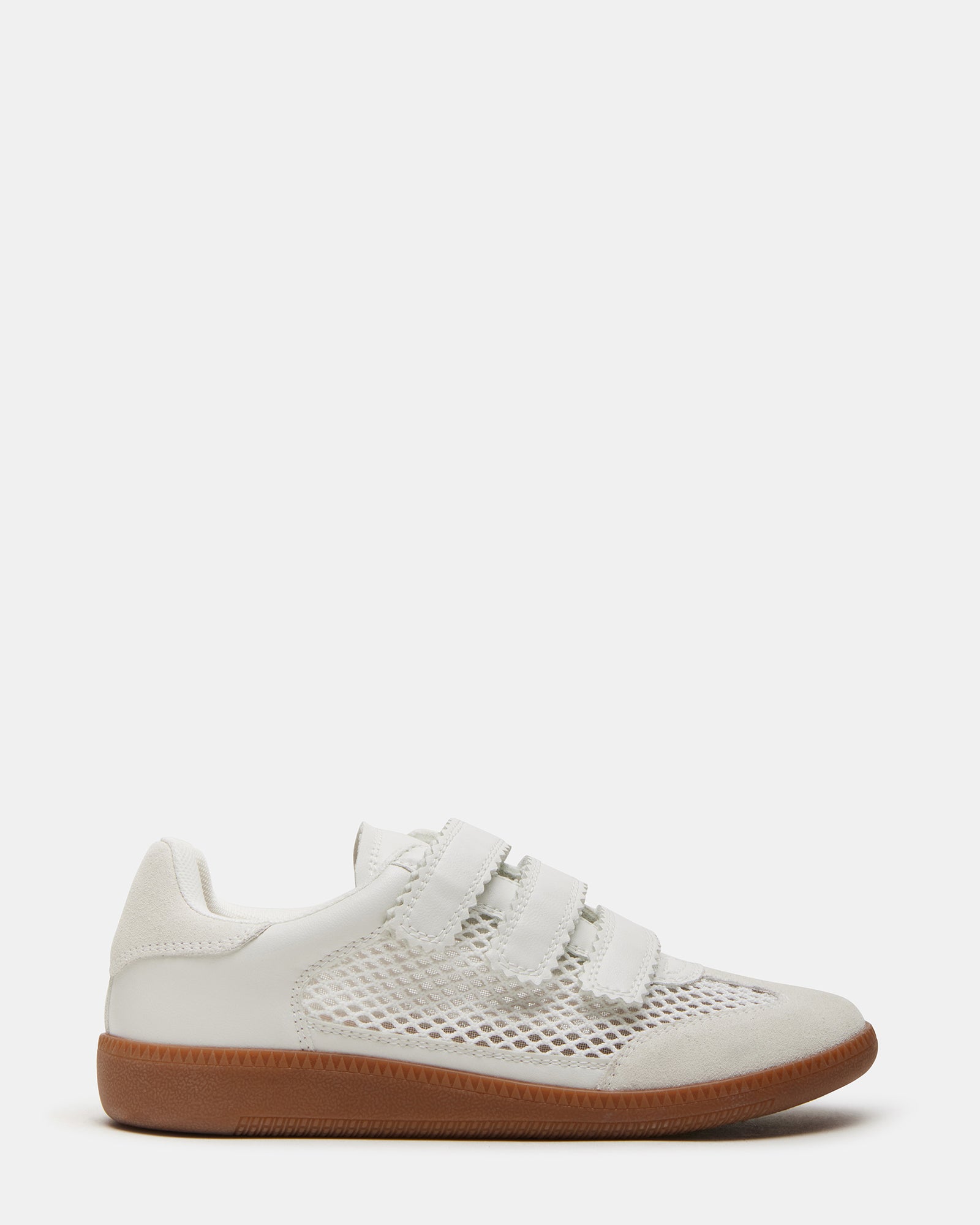 Side view of stylish white sneakers with Velcro closure for women