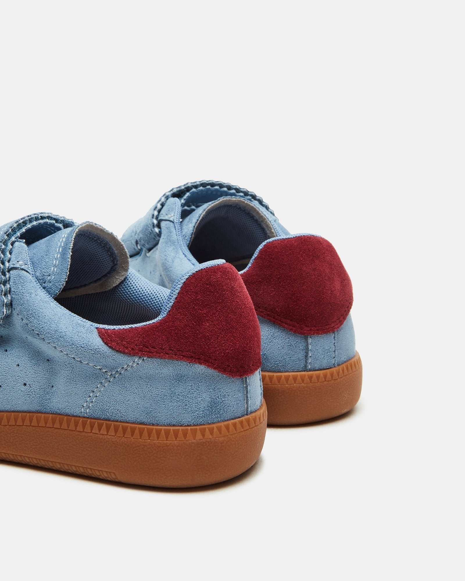 Close-up of the shoes microsuede material and Velcro closure.