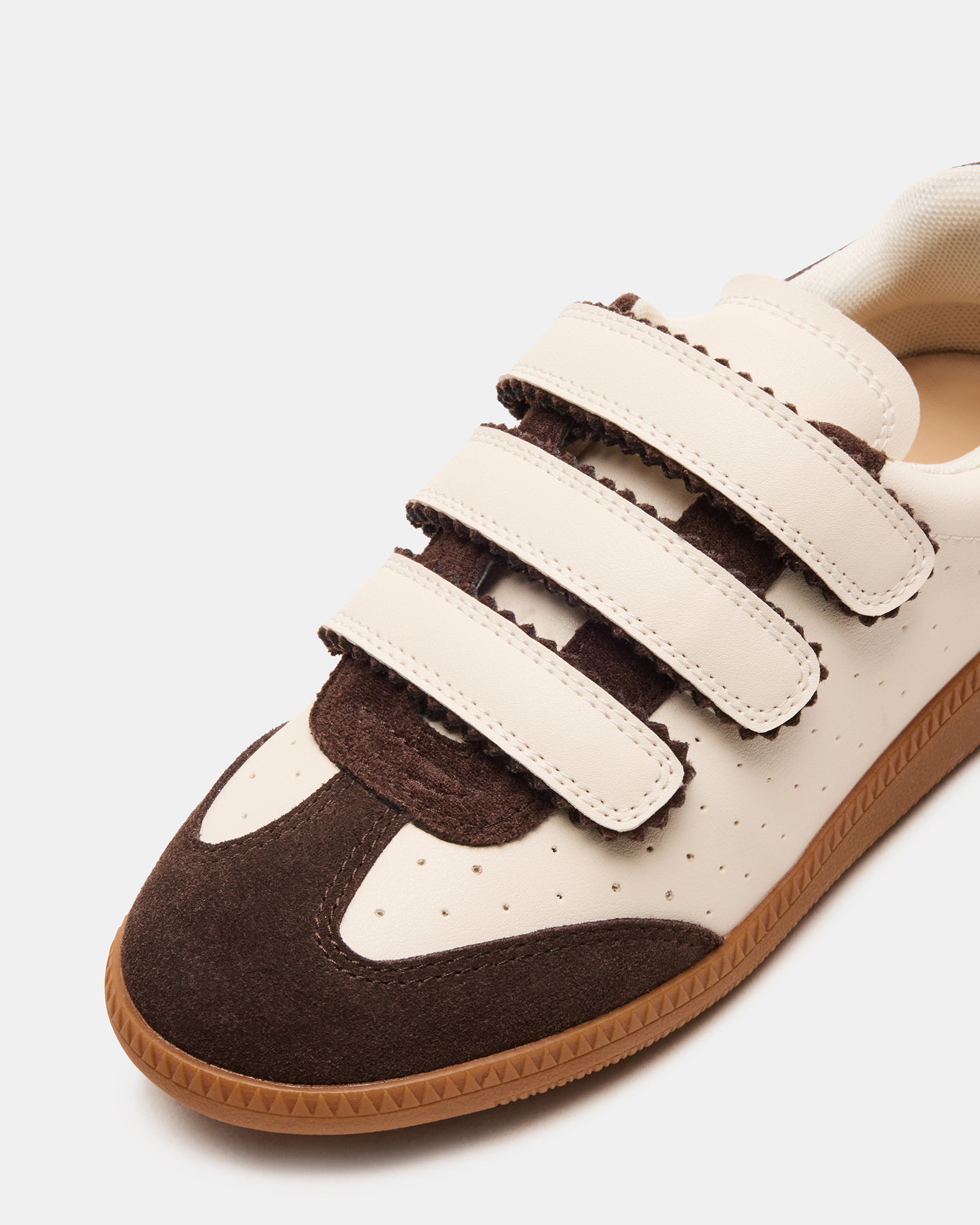 Front angle of the sneakers highlighting the suede and synthetic upper.