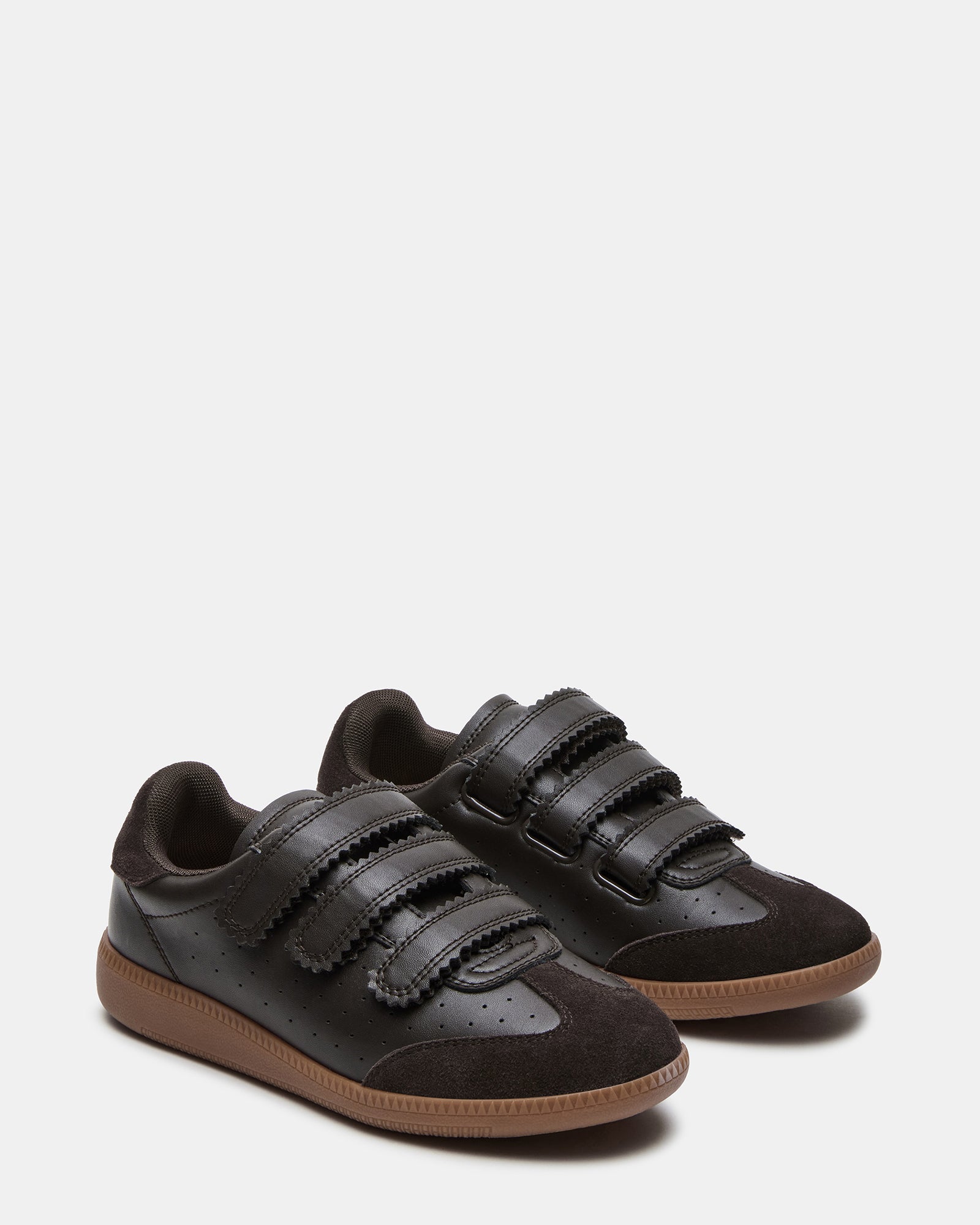 Woman wearing suede sneakers with casual outfit