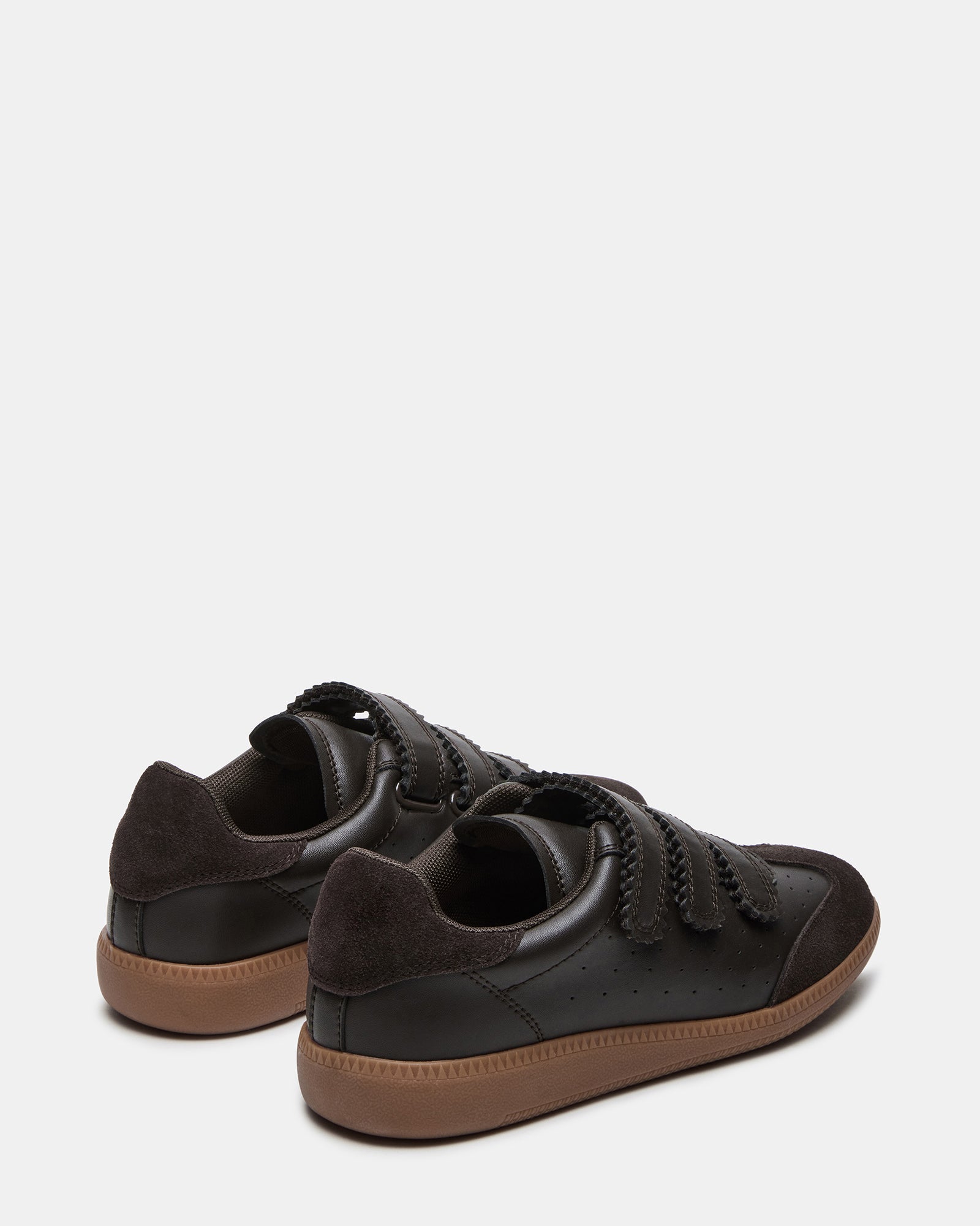 Woman wearing suede sneakers with casual outfit