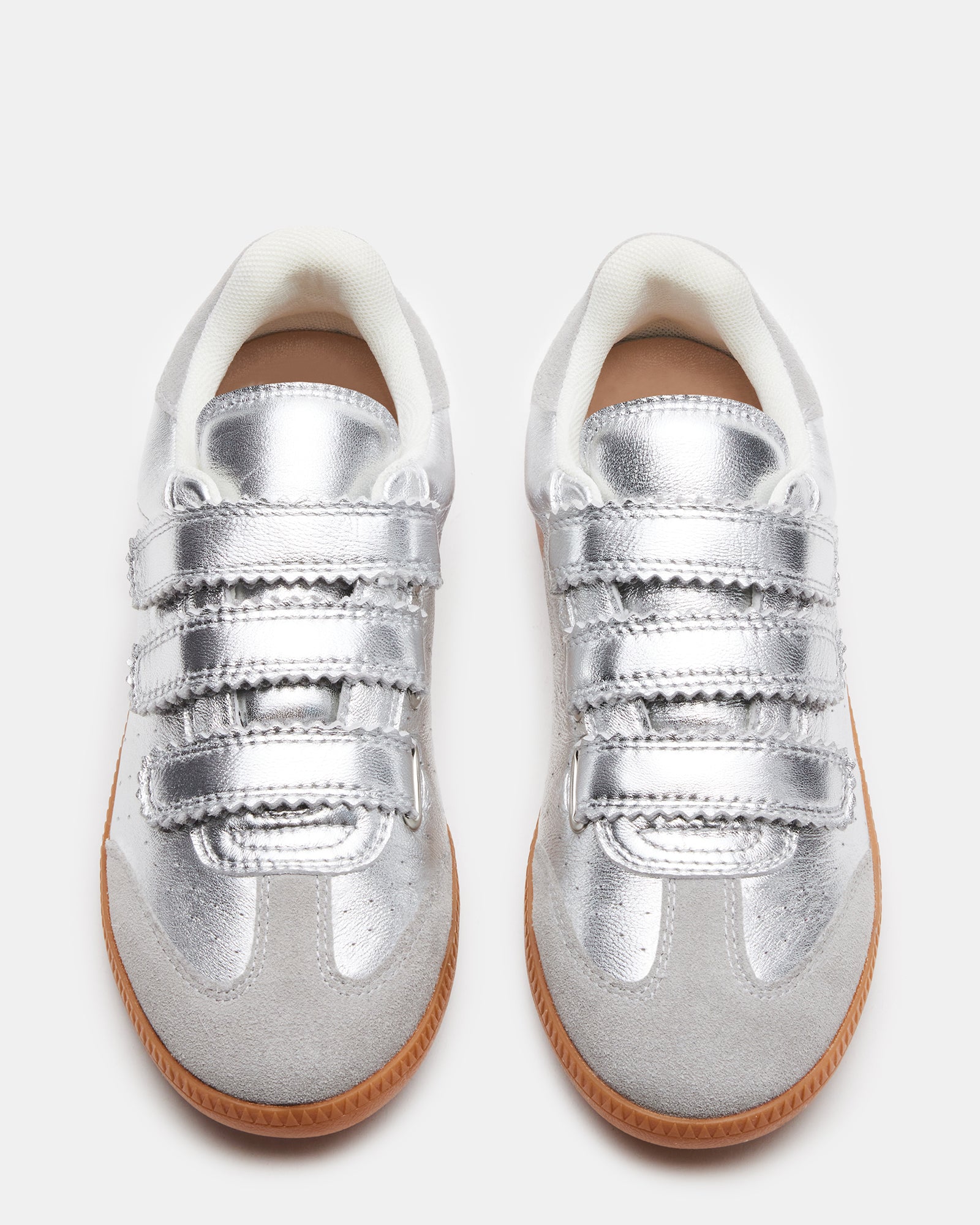 Overhead close-up of velcro sneakers showing sleek silhouette and stitching details