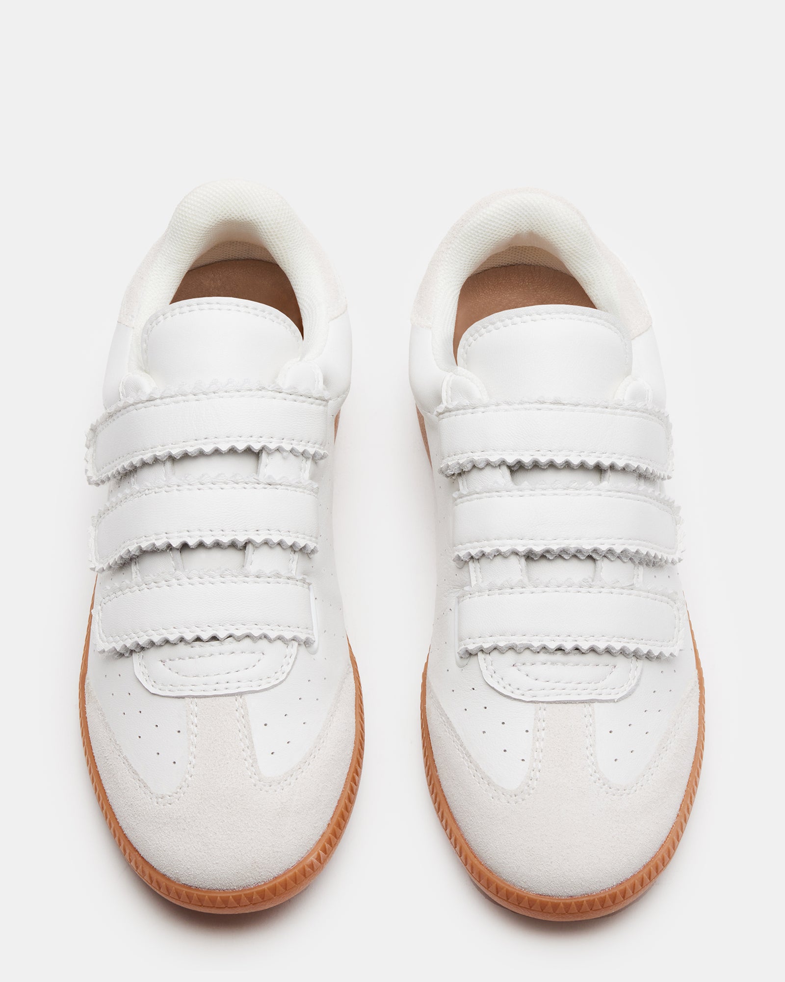 Close-up of the Velcro closure on Momentum White sneakers, emphasizing practicality and ease.