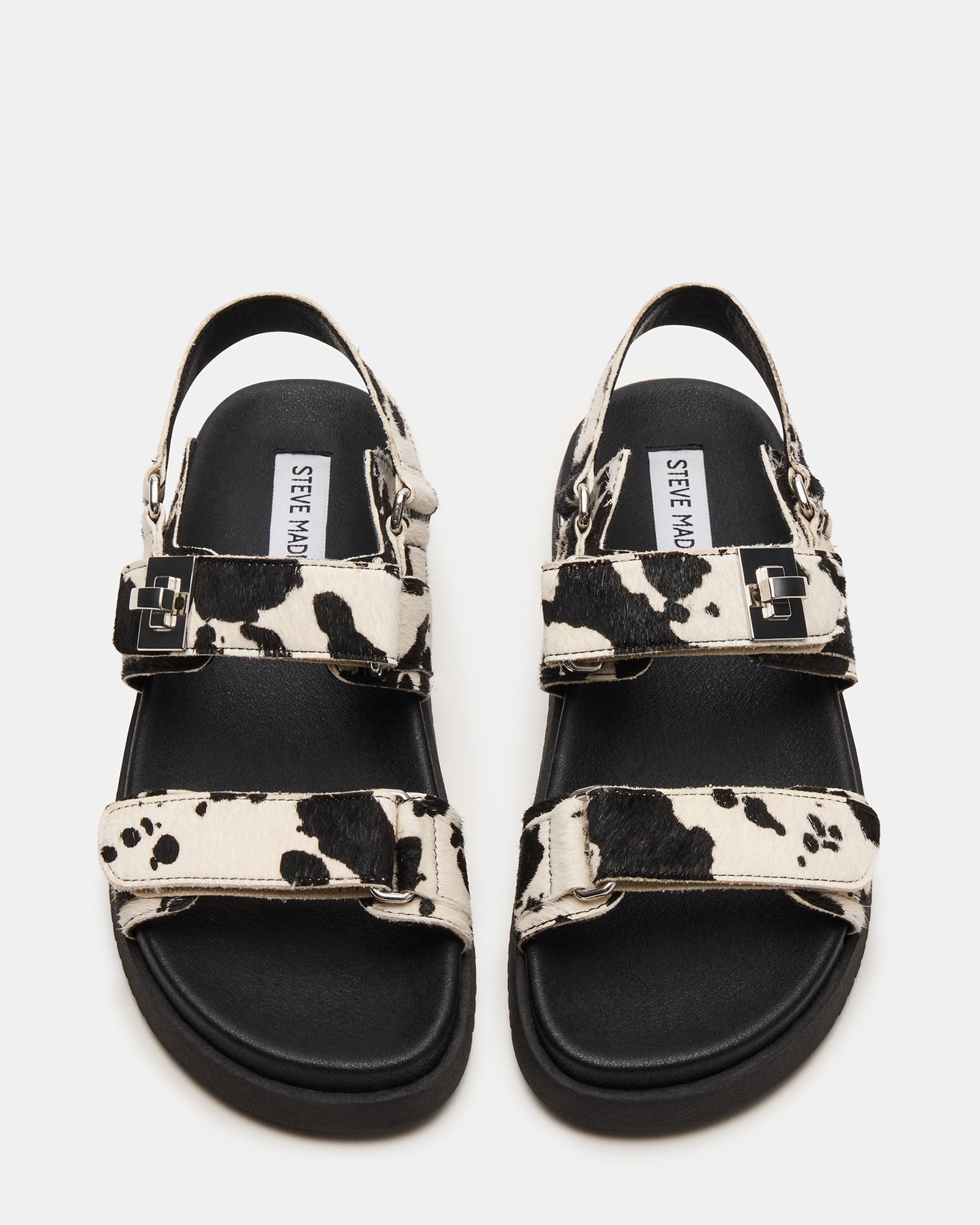 Top view of the cow print leather sandals highlighting the adjustable hook-and-loop strap