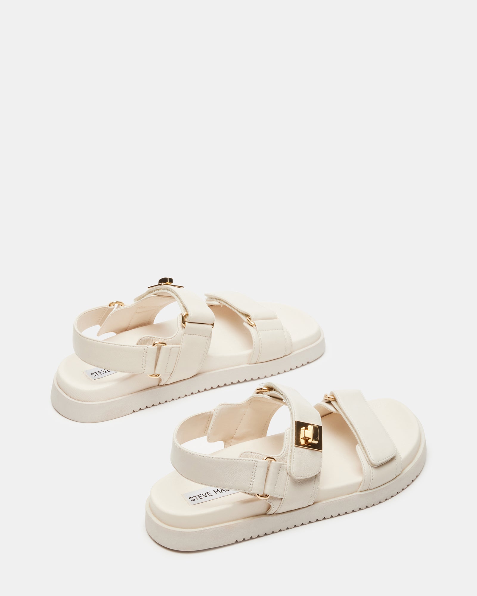 Lifestyle shot featuring ladies flatform sandals paired with denim for a relaxed street look