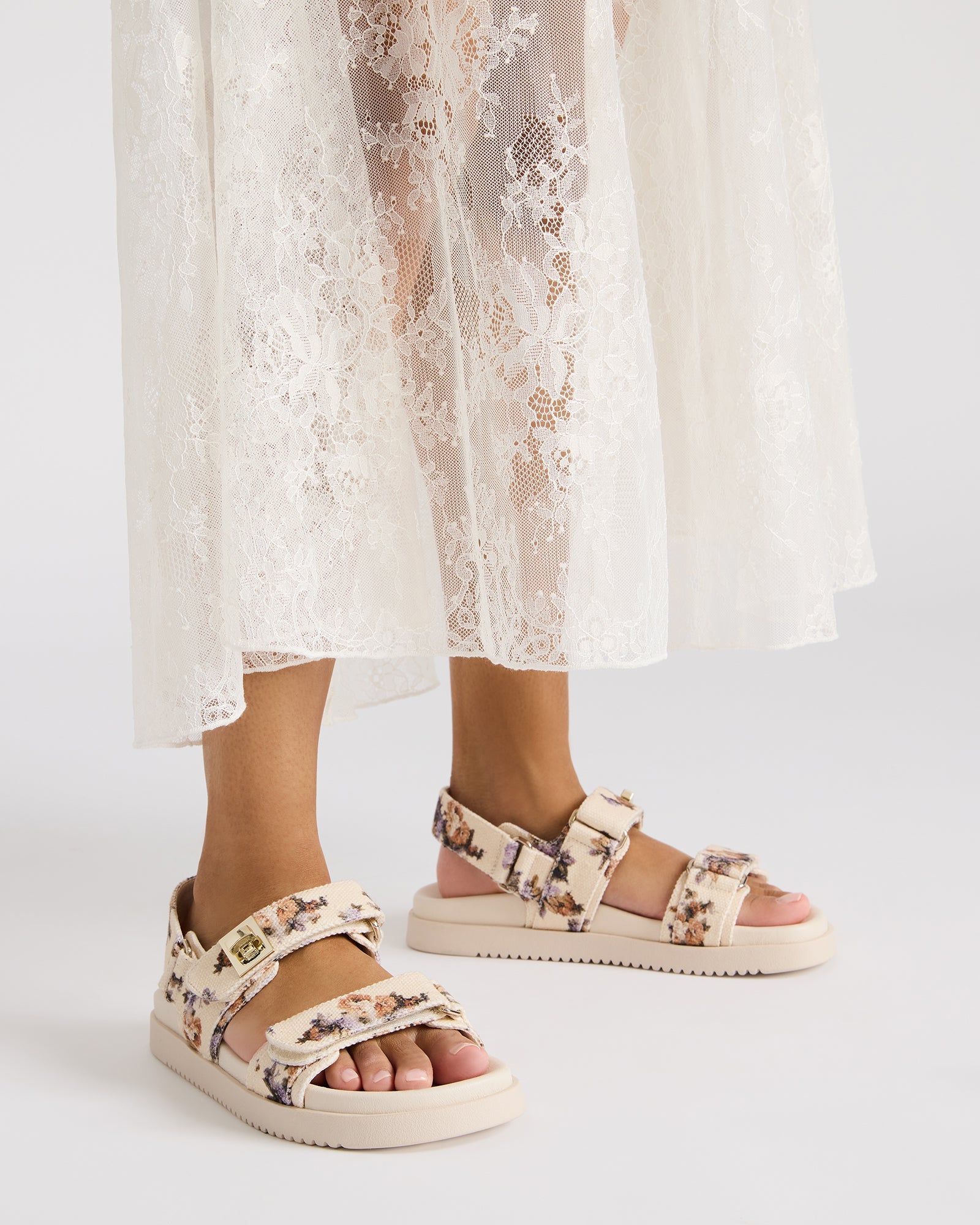 Close-up of the gold-tone accents on Mona Flatform Sandals.