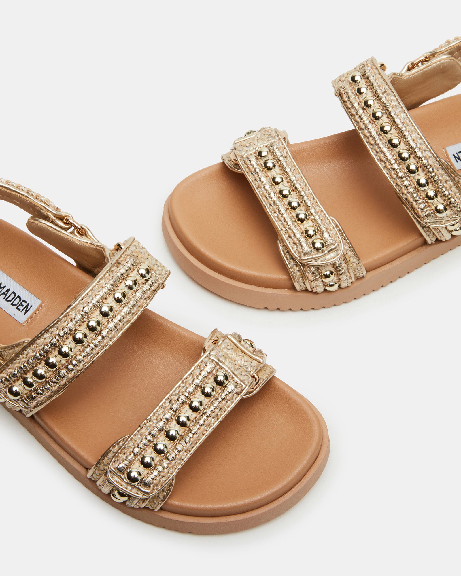 Mona sandals and anklet set on a stylish outdoor background.