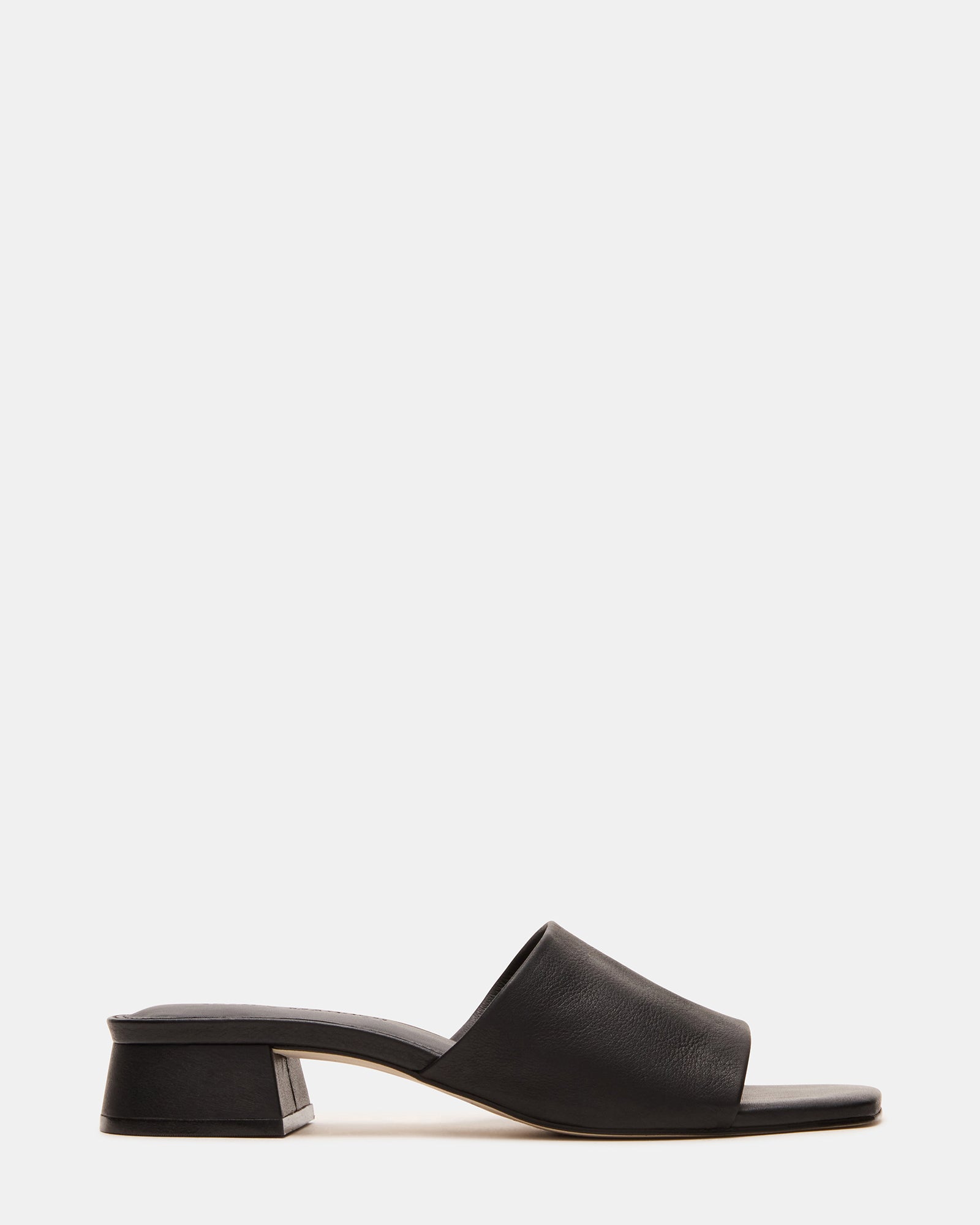 Side view of Montgomery leather sandals for women on cobblestone