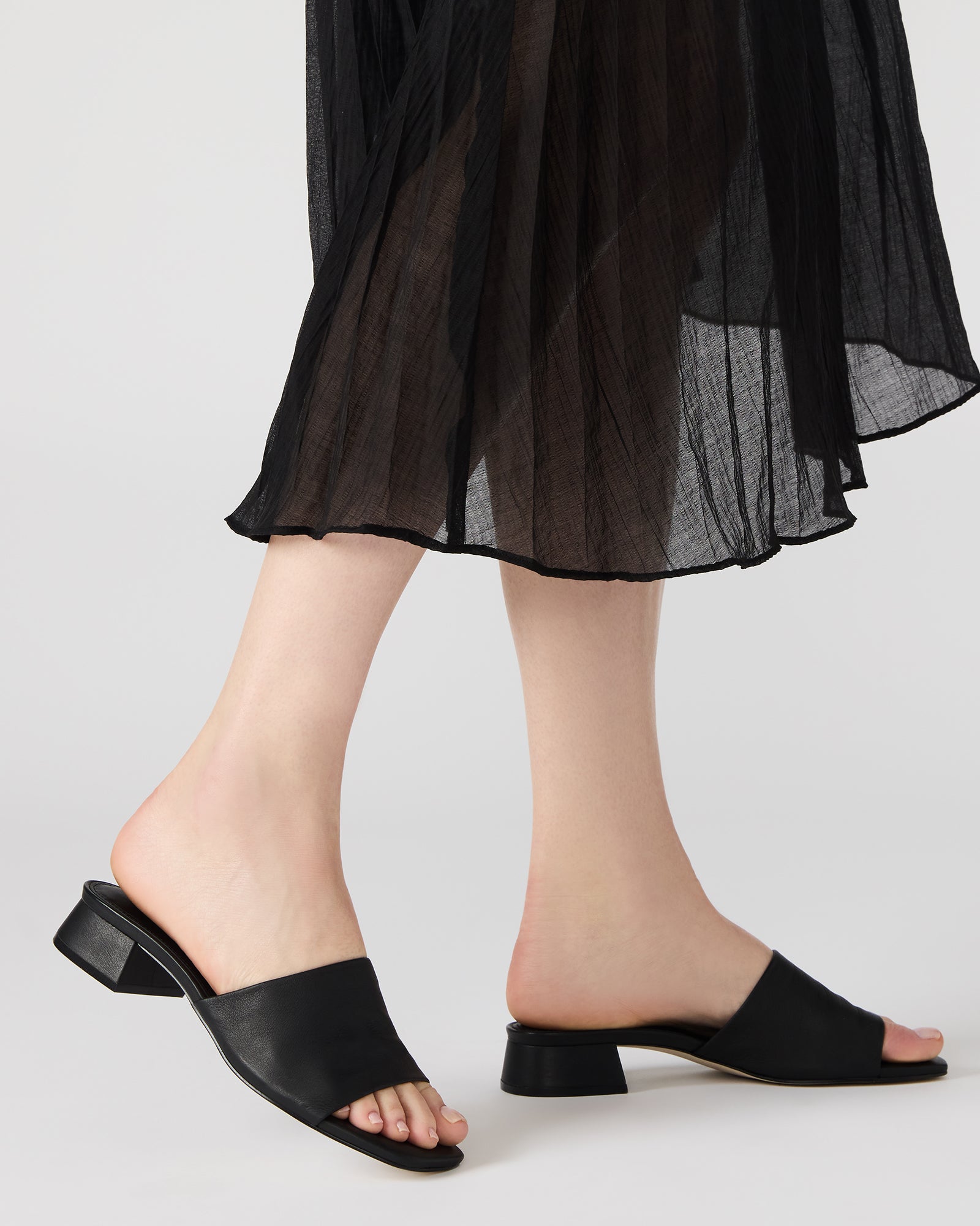 Close-up of square toe design on brown leather sandals