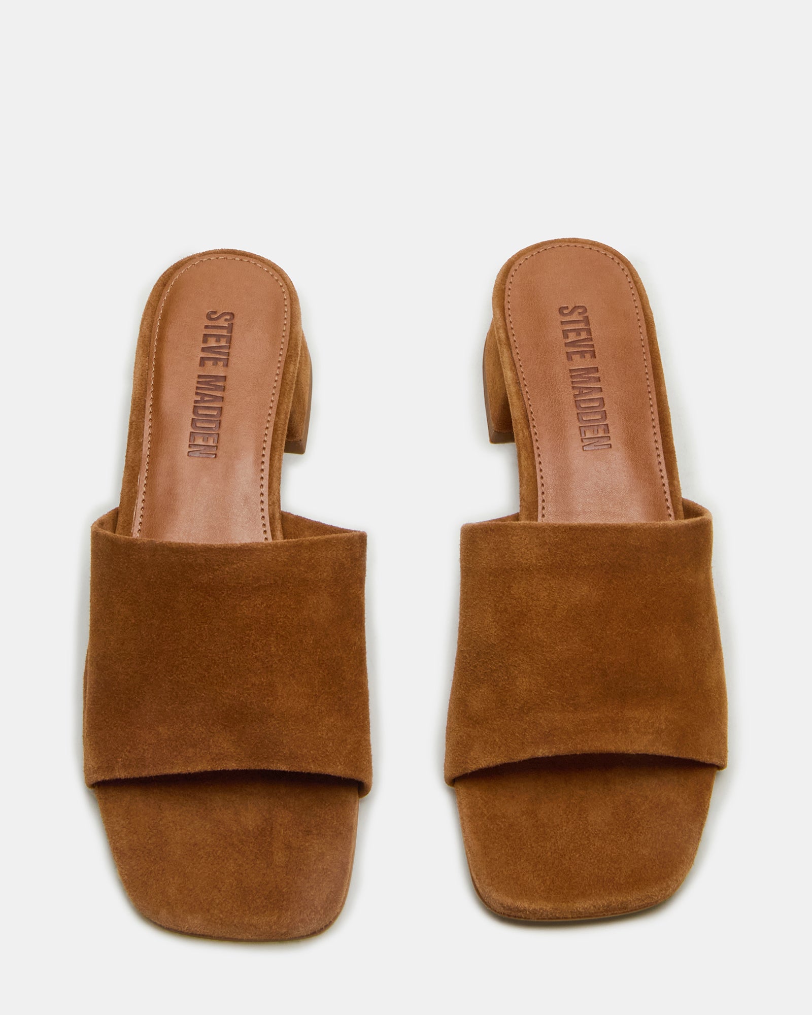 Side profile showing 1.25 inch heel on platform suede slide