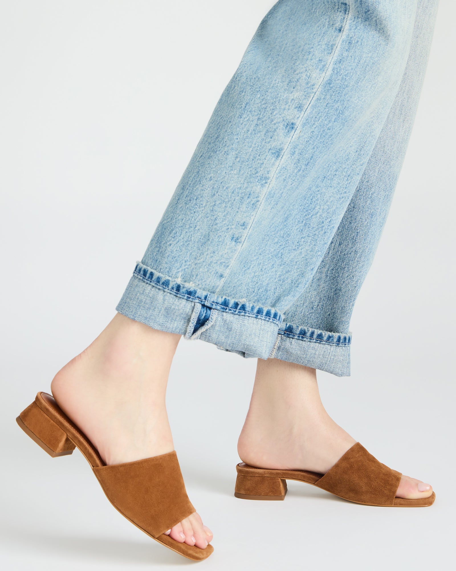 Side profile showing 1.25 inch heel on platform suede slide